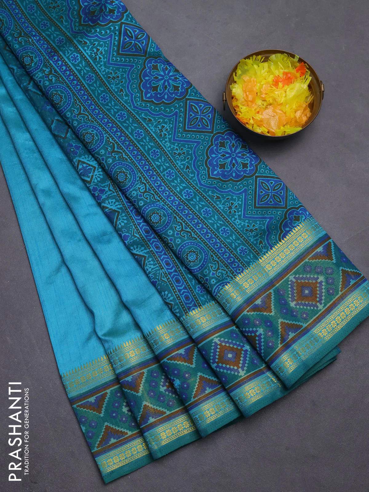 Semi tussar saree dual shade of teal blue with plain body and ikat woven zari border