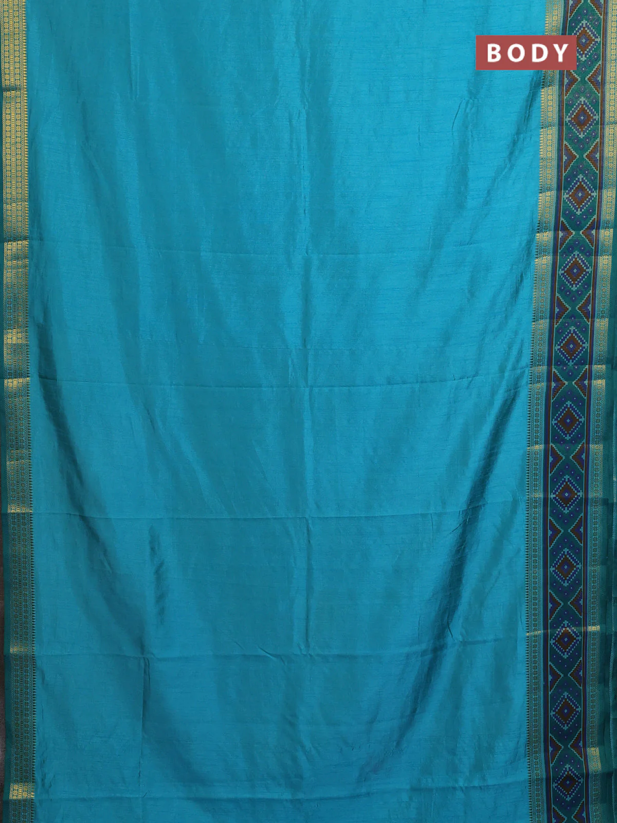 Semi tussar saree dual shade of teal blue with plain body and ikat woven zari border - Image 2