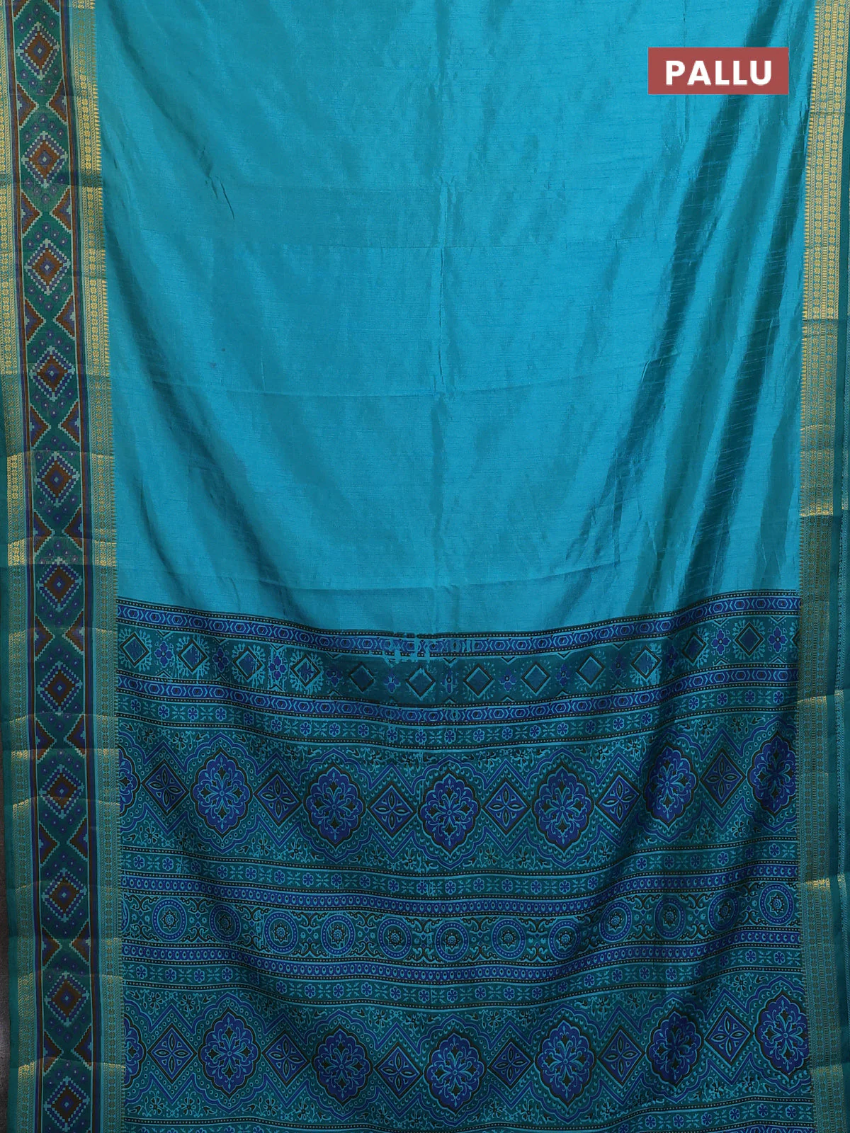Semi tussar saree dual shade of teal blue with plain body and ikat woven zari border - Image 3