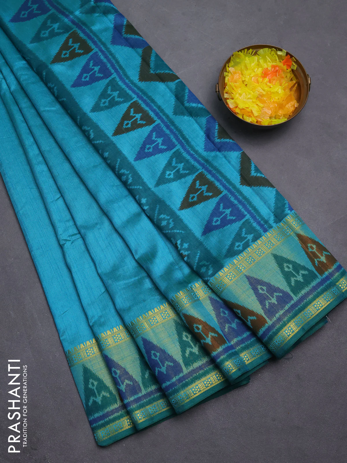 Semi tussar saree dual shade of teal blue with plain body and ikat woven zari border