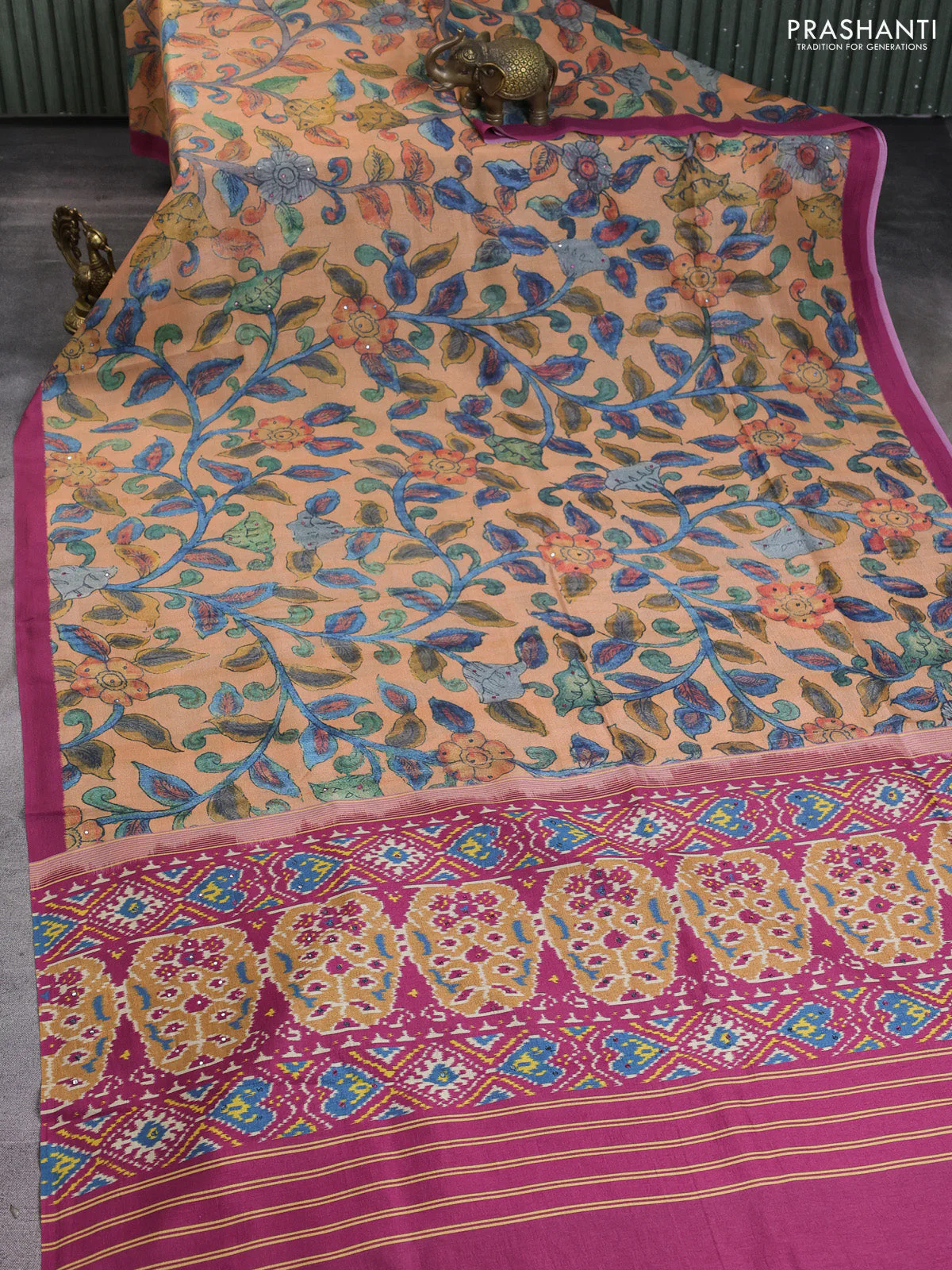 Semi tussar saree orange and pink with allover kalamkari prints and mirror work