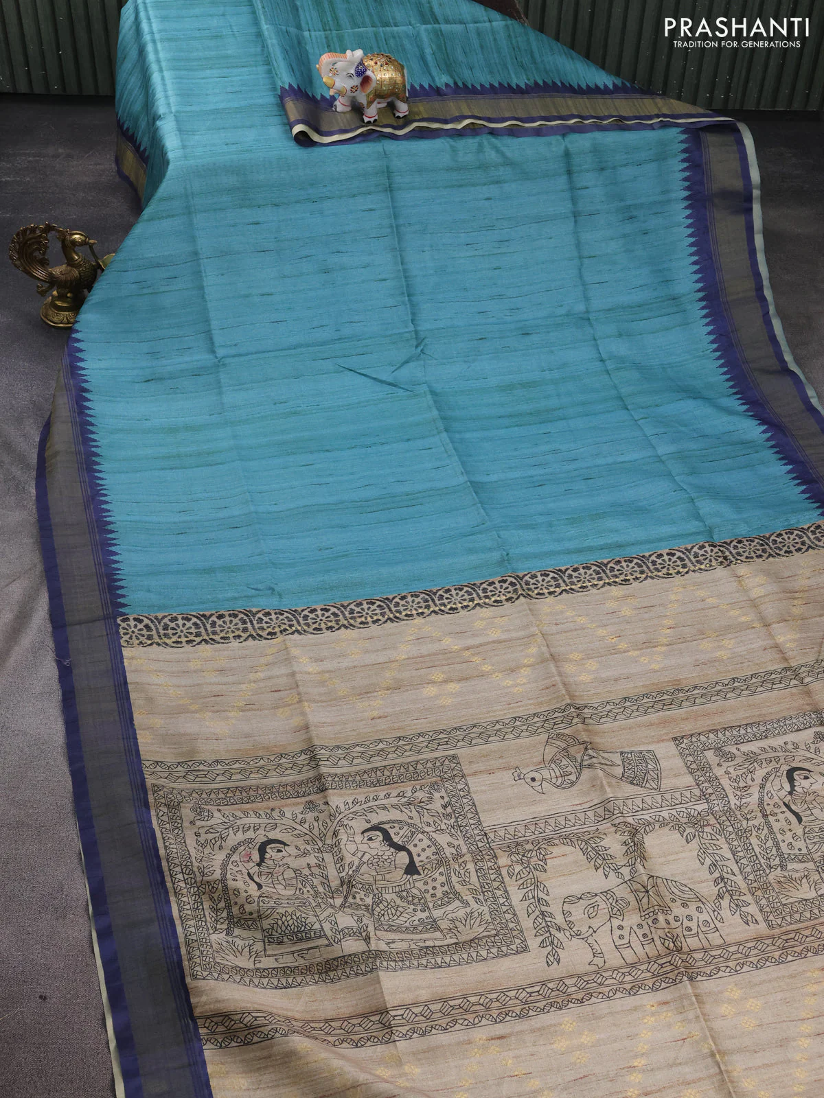 Semi tussar saree teal blue and beige with plain body and madhubani printed pallu