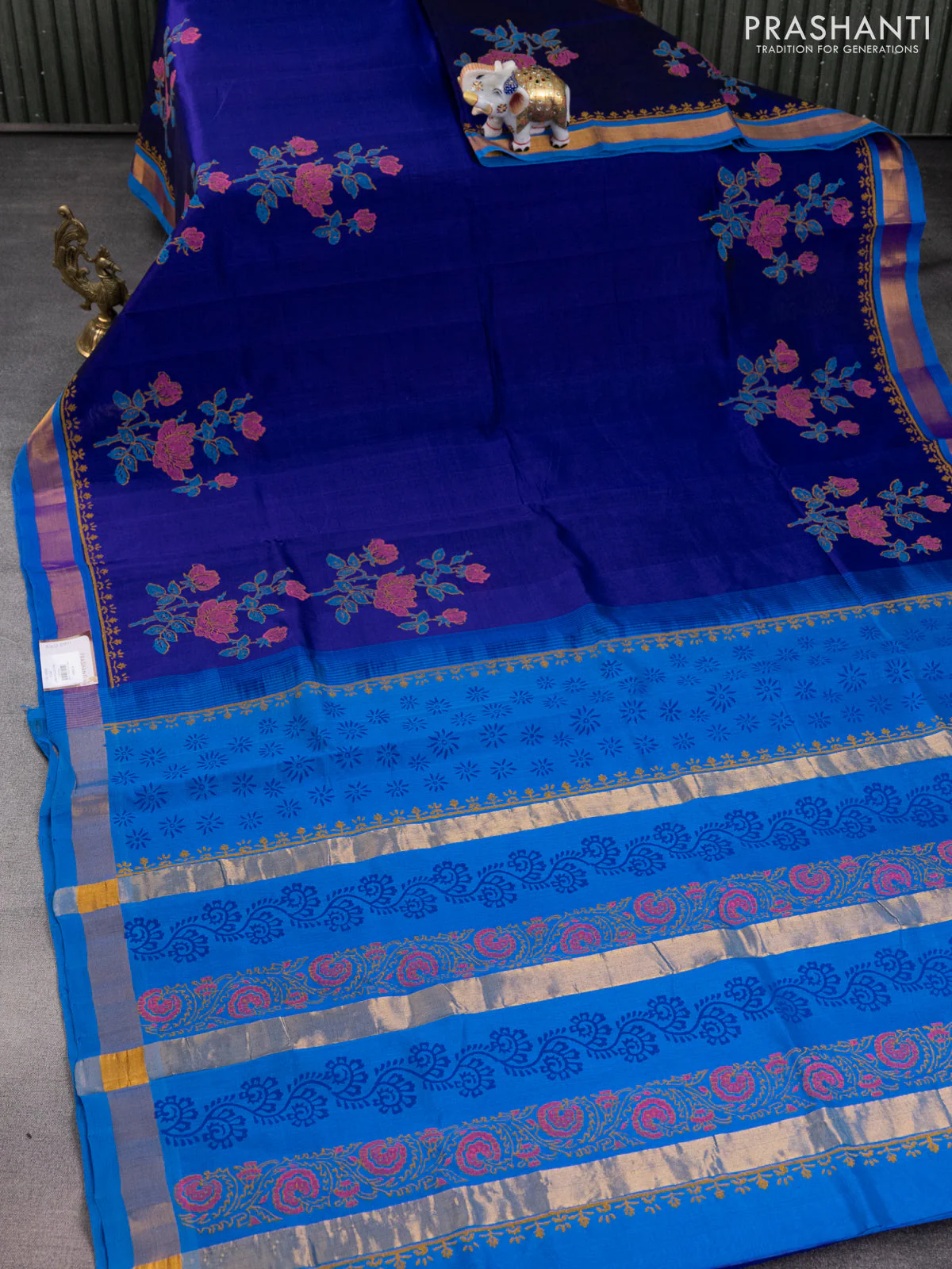 Silk cotton block printed saree blue and cs blue with allover floral prints and zari woven border - Image 2