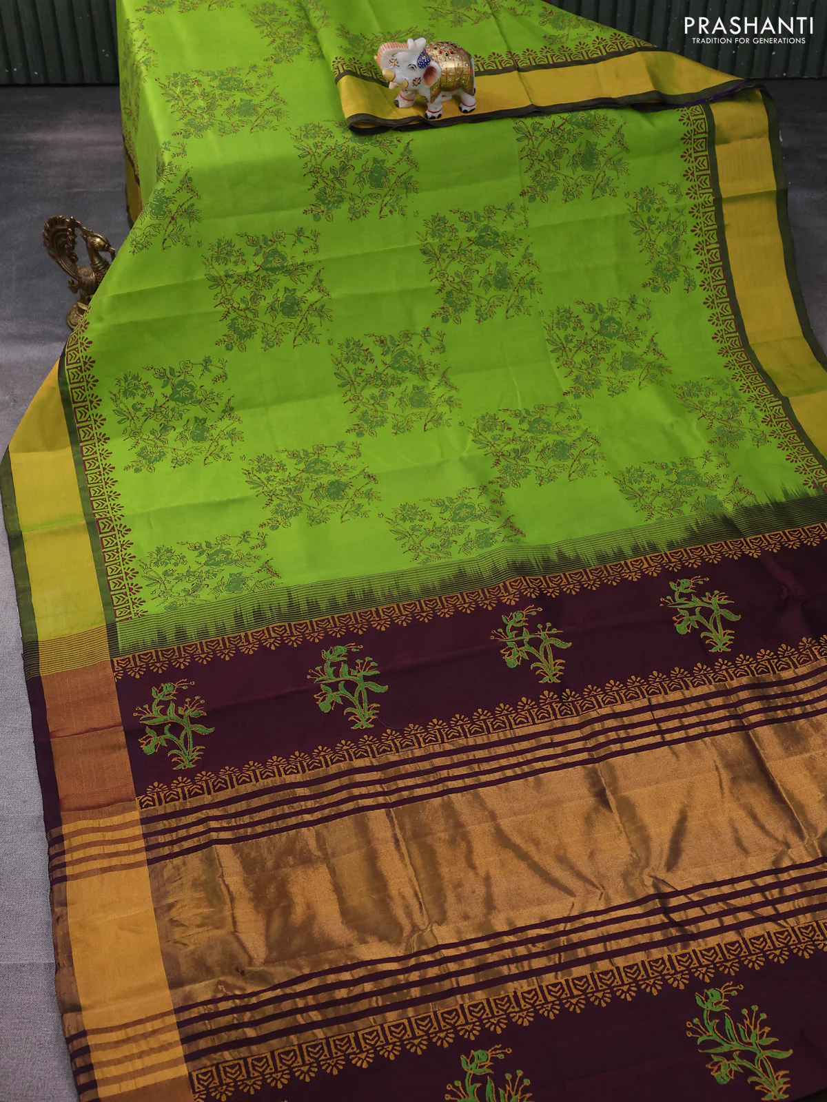 Silk cotton block printed saree light green and wine shade with allover floral prints and zari woven border - Image 2