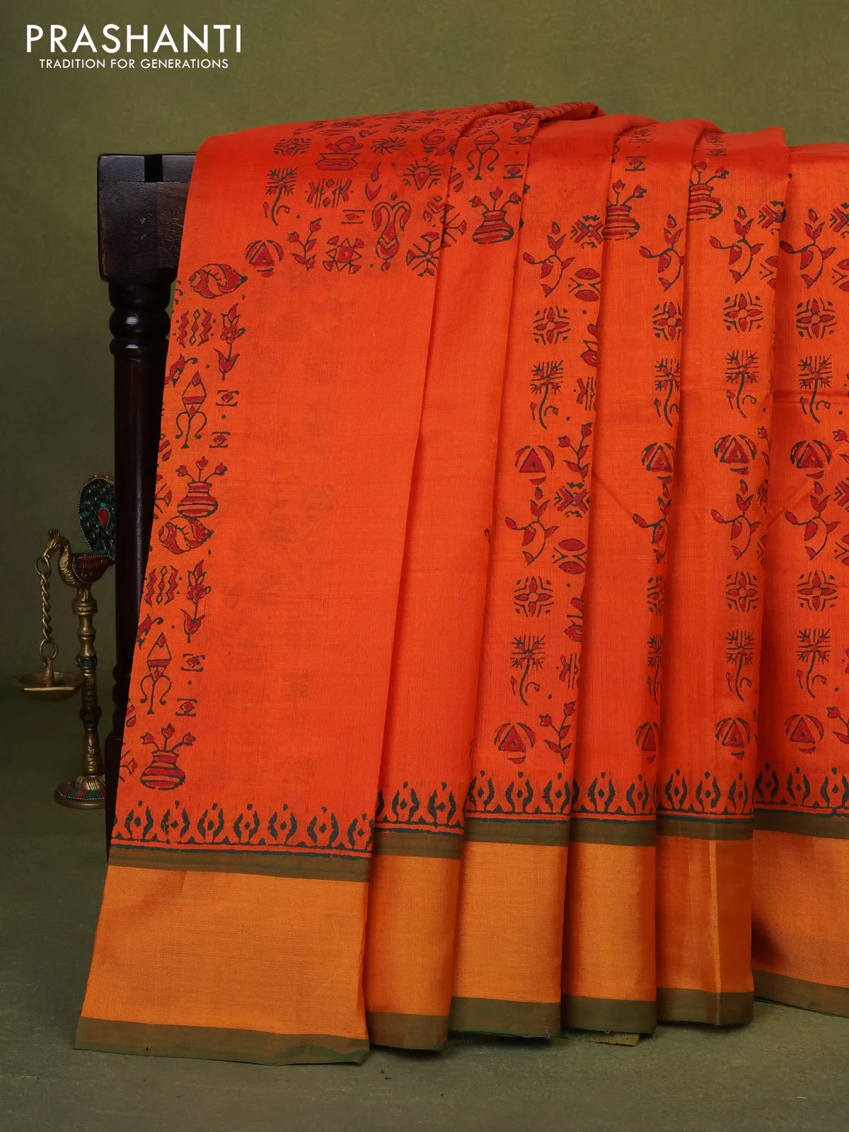 Silk cotton block printed saree orange and green with allover prints and zari woven border