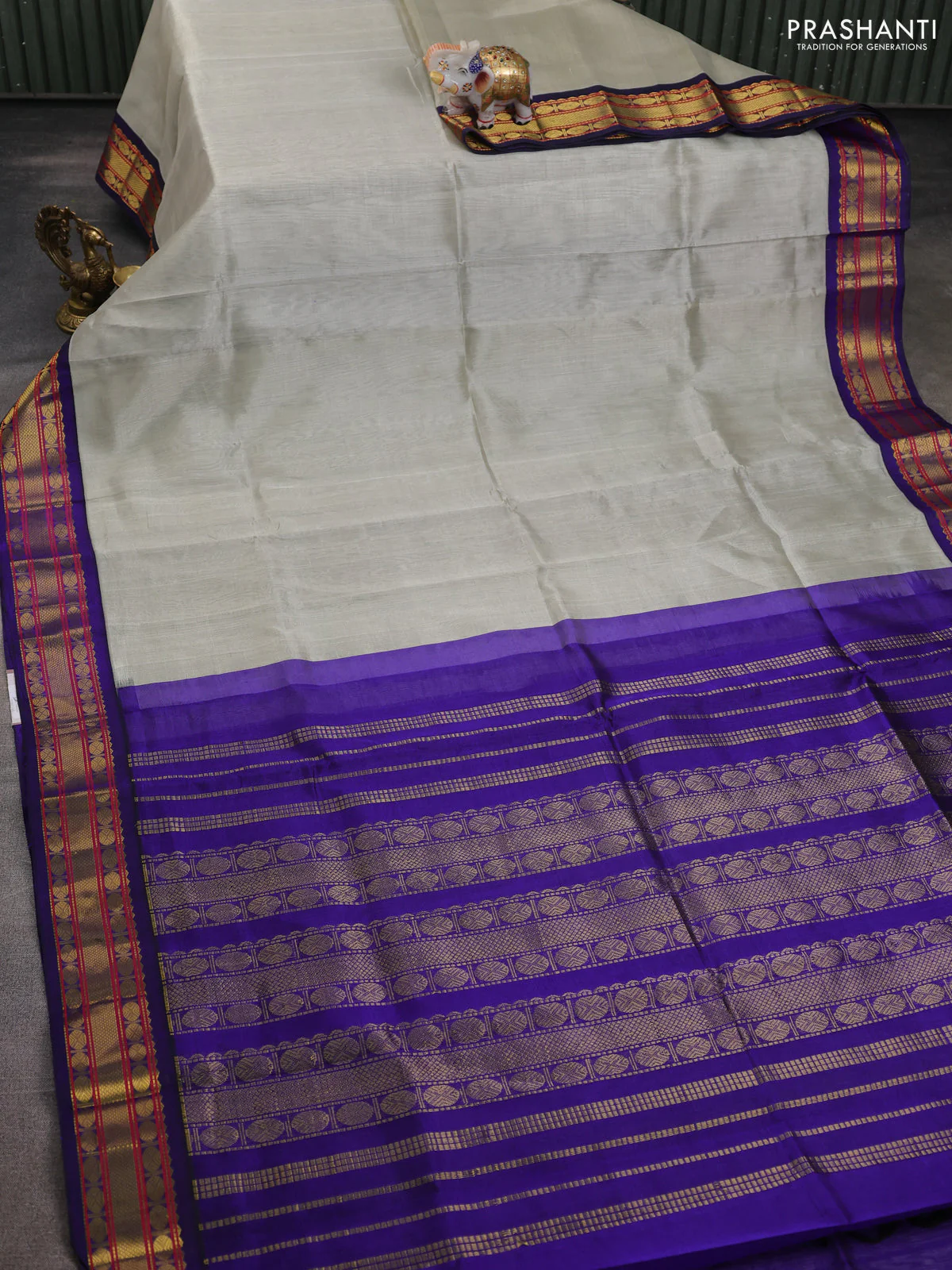 Silk cotton saree beige and blue with plain body and zari woven korvai border - Image 2