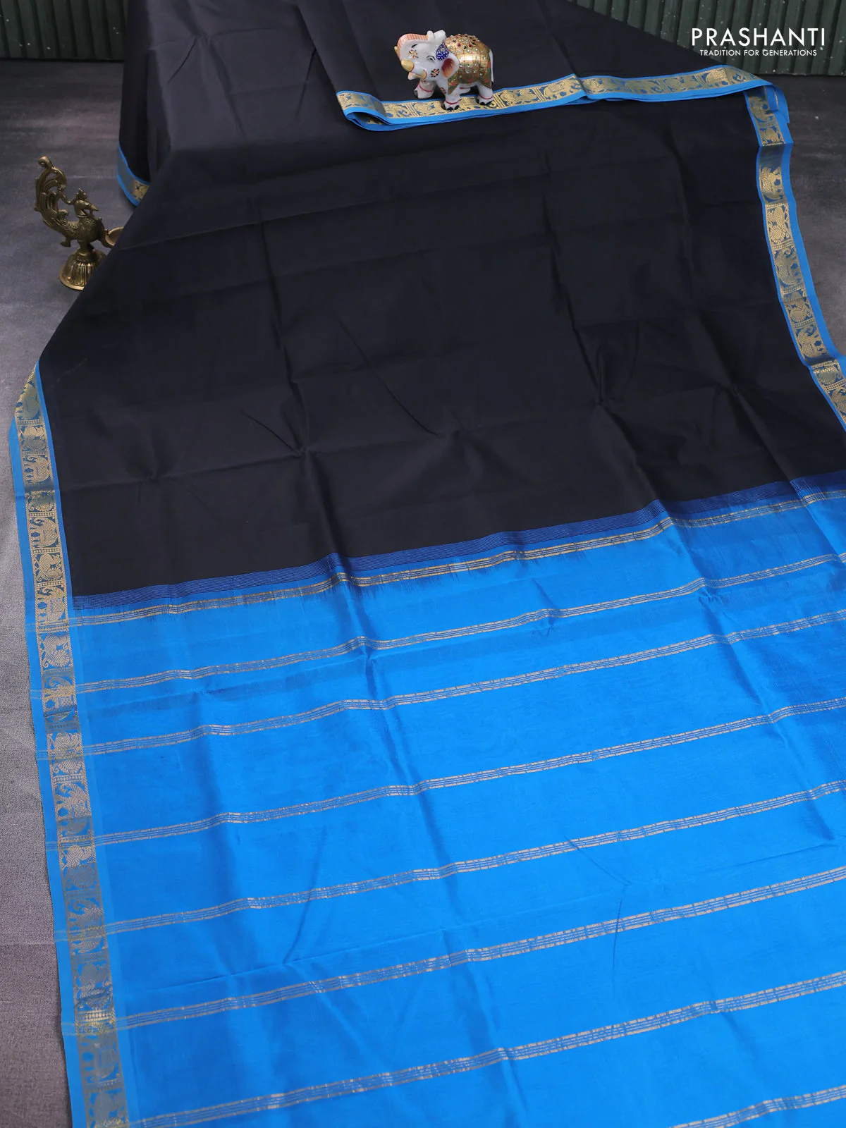 Silk cotton saree black and cs blue with plain body and zari woven border - Image 2