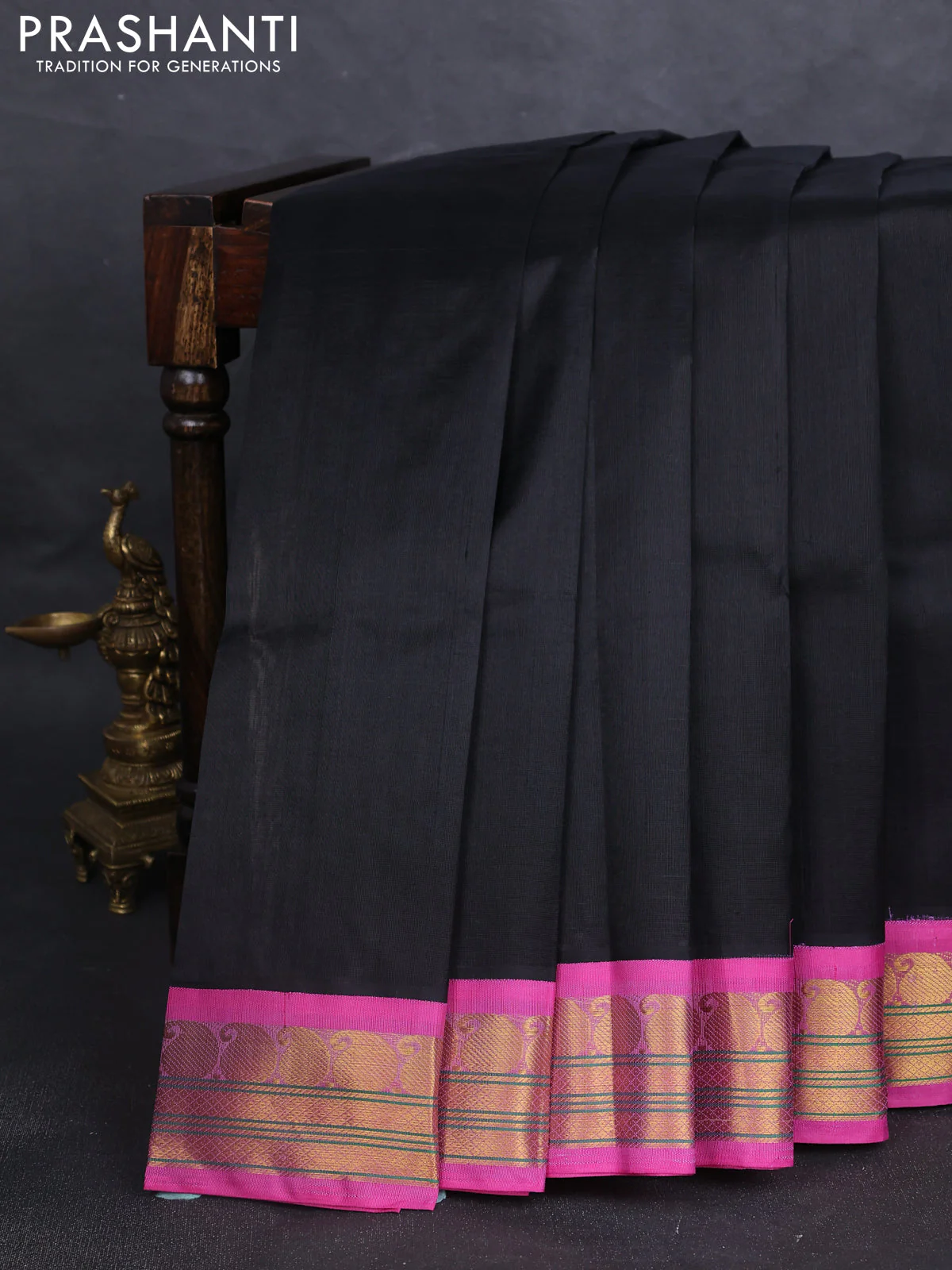 Silk cotton saree black and pink shade with plain body and paisley zari woven korvai border