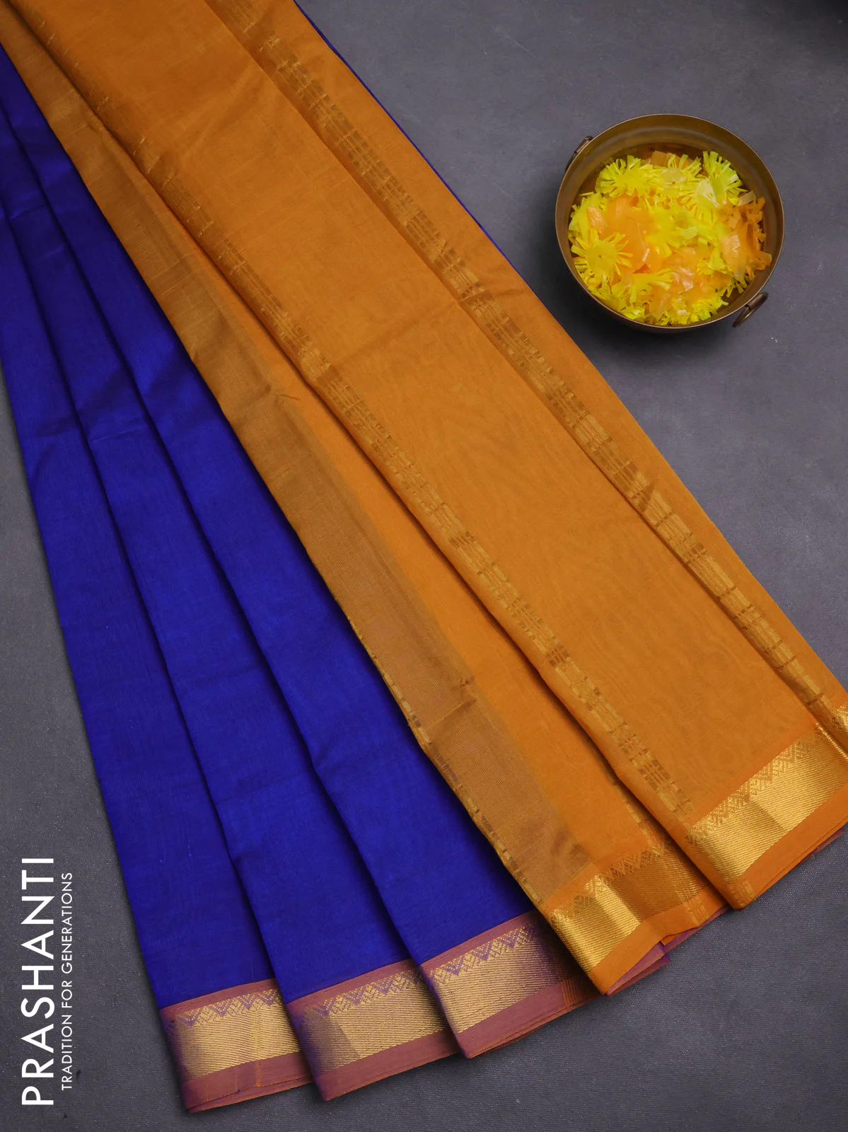 Silk cotton saree blue and mustard yellow with plain body and zari woven border
