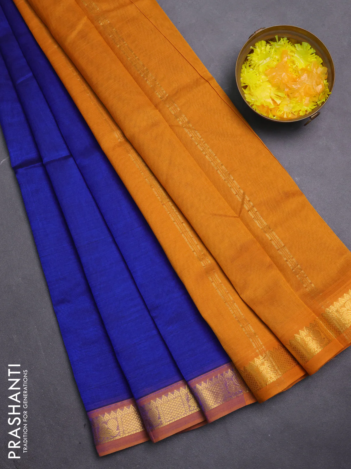 Silk cotton saree blue and mustard yellow with plain body and zari woven border