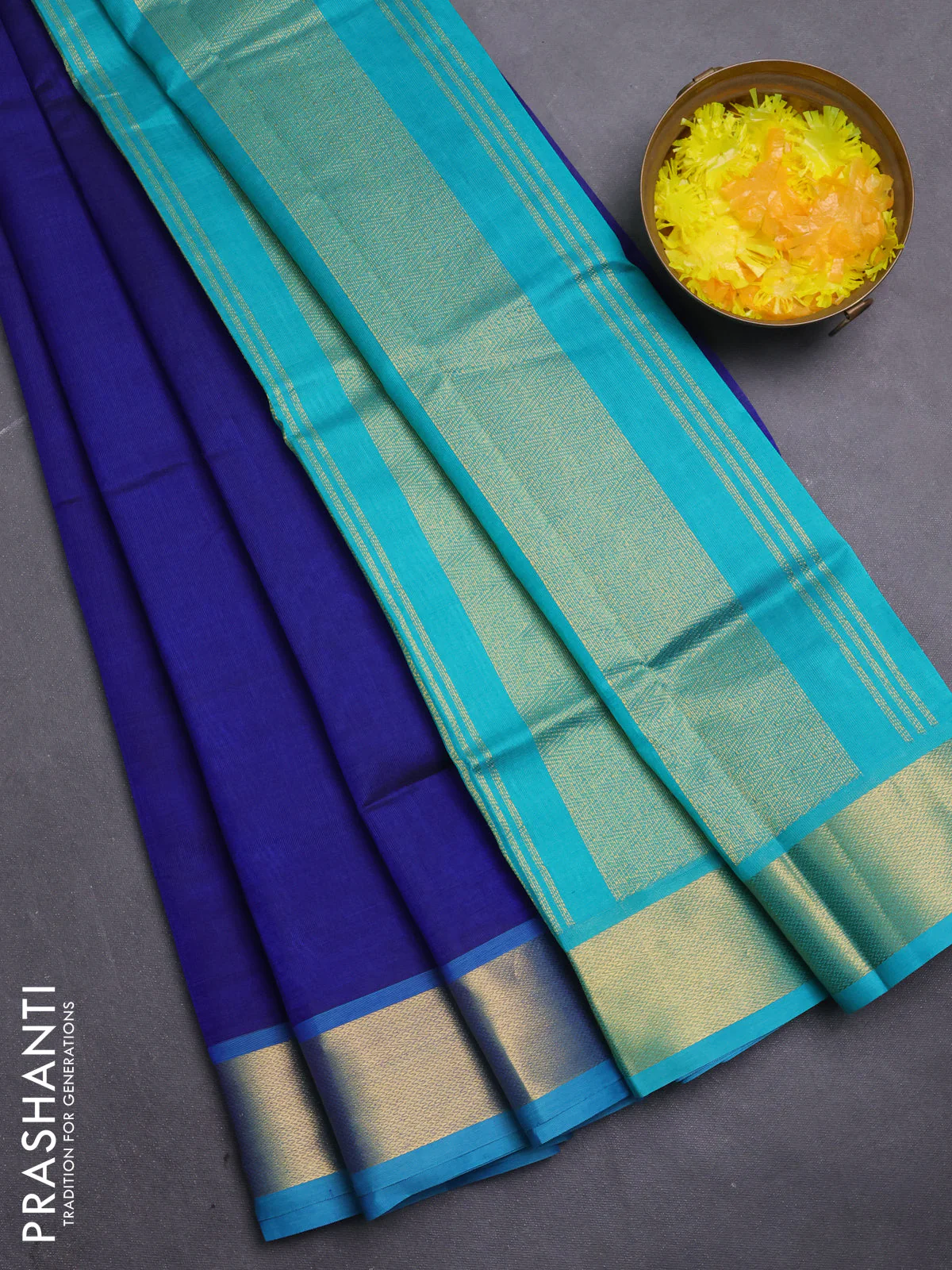 Silk cotton saree blue and teal blue with plain body and zari woven border