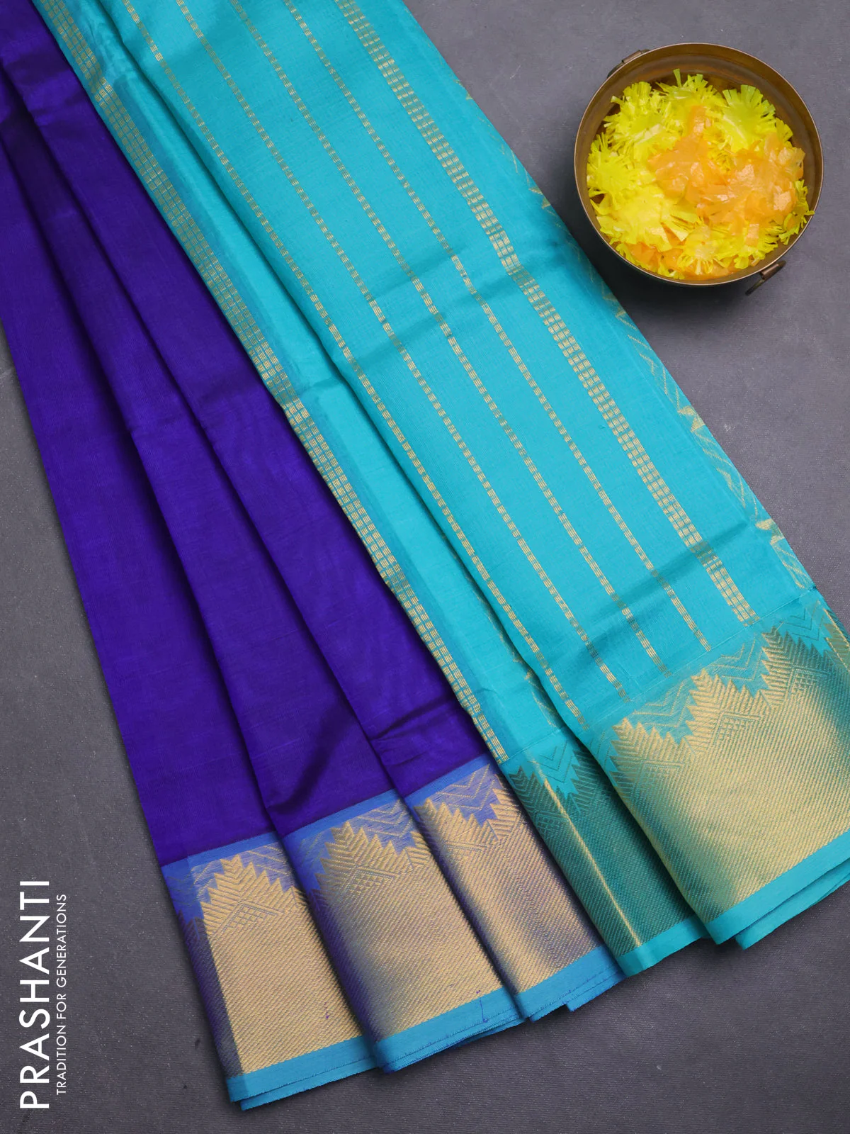 Silk cotton saree blue and teal blue with plain body and zari woven border