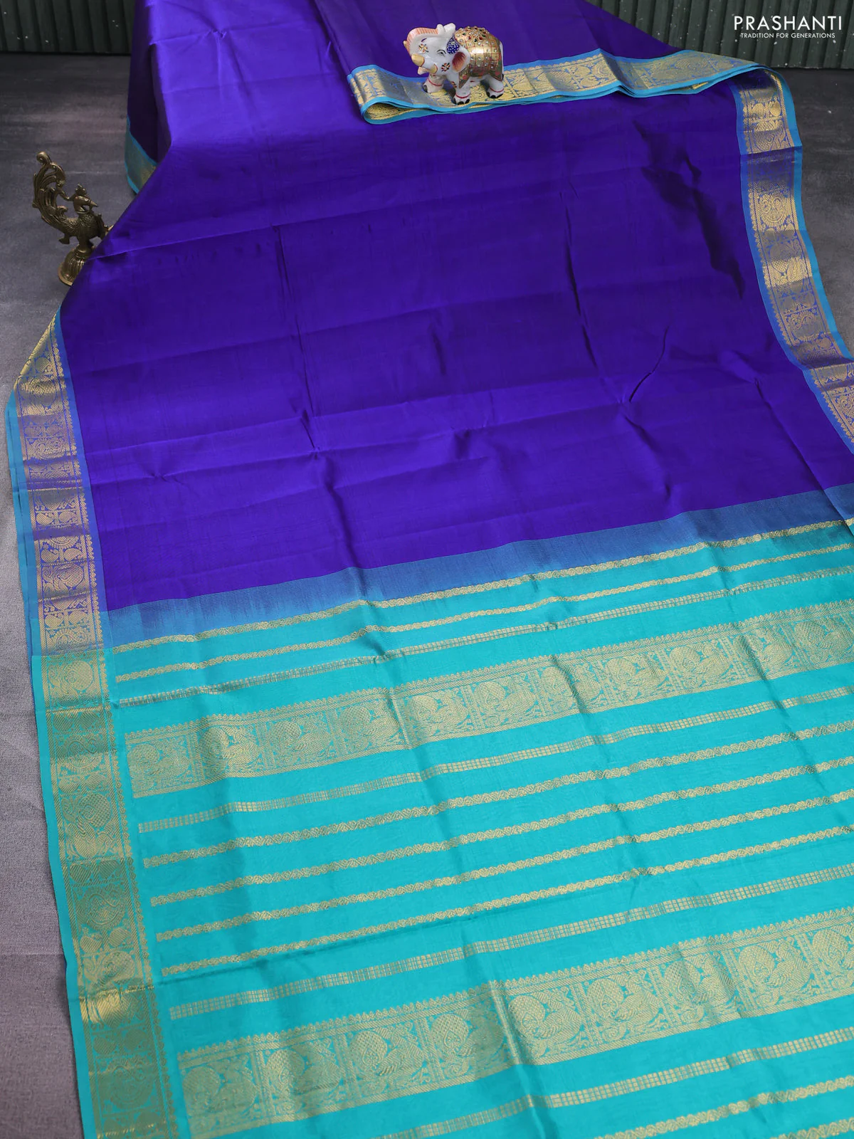 Silk cotton saree blue and teal blue with plain body and zari woven border - Image 2