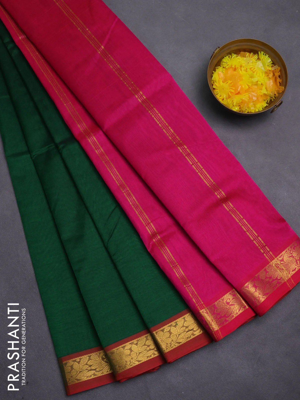 Silk cotton saree bottle green and pink with plain body and zari woven border