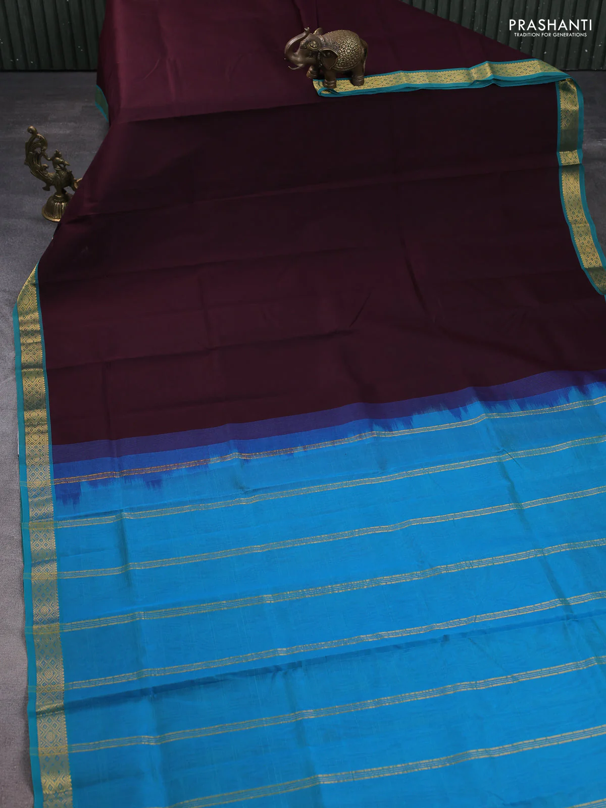 Silk cotton saree coffee brown and dual shade of teal blue with plain body and zari woven border - Image 2