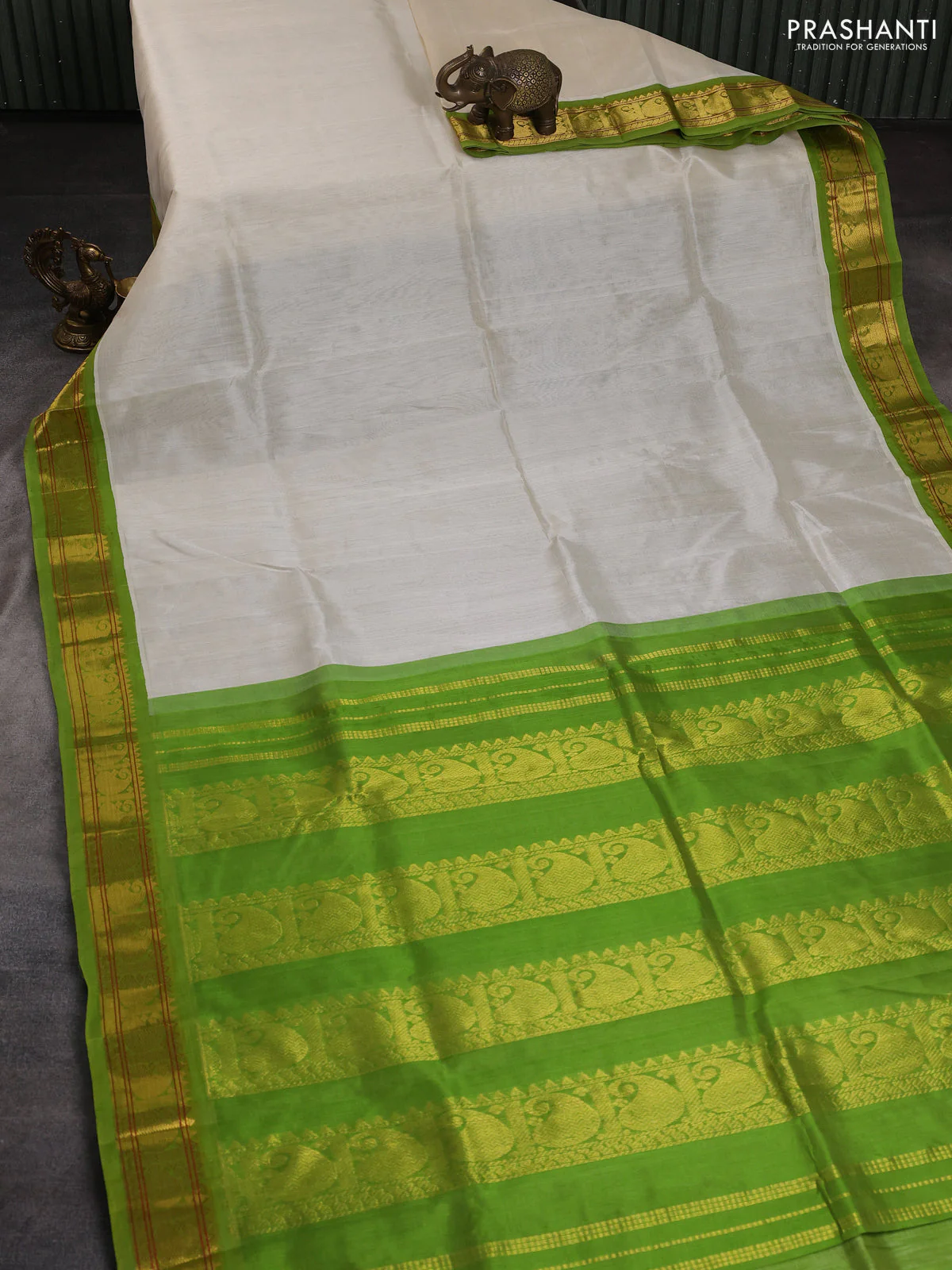 Silk cotton saree cream and light green with plain body and paisley zari woven korvai border - Image 2