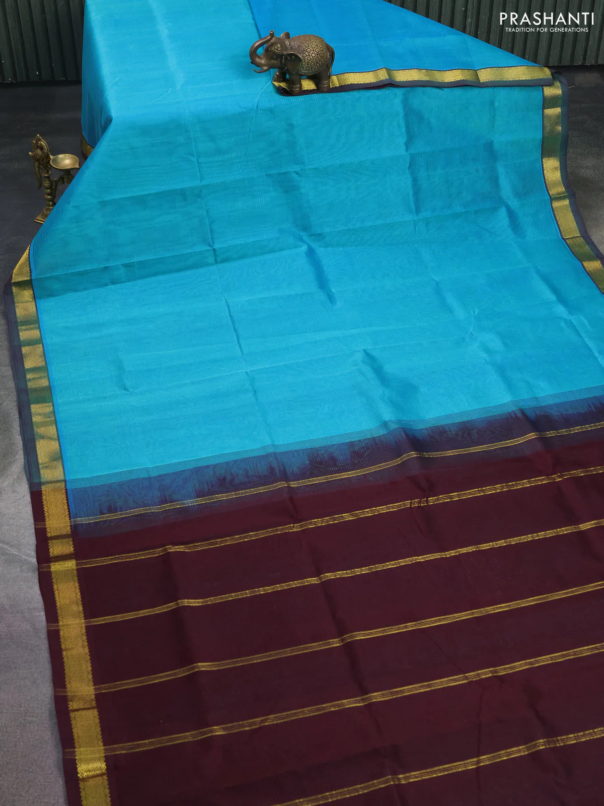 Silk cotton saree cs blue and coffee brown with plain body and zari woven border - Image 2