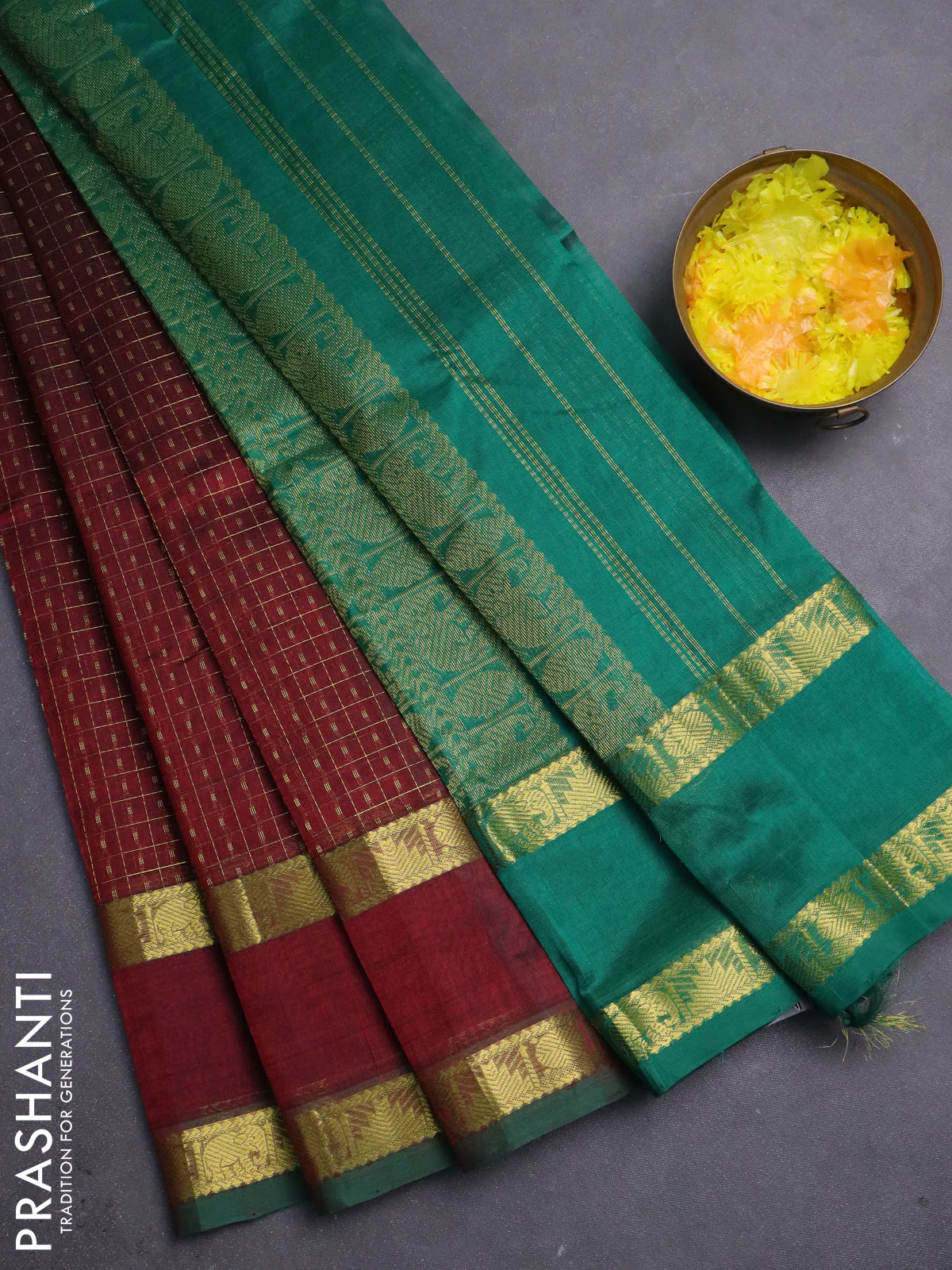 Silk cotton saree deep maroon and green with allover lakshadeepam pattern and rettapet zari woven border