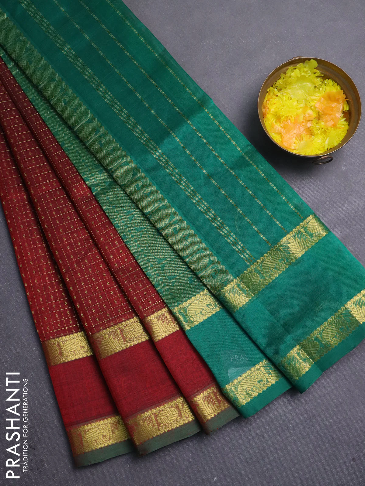 Silk cotton saree deep maroon and green with allover lakshadeepam pattern and rettapet zari woven border
