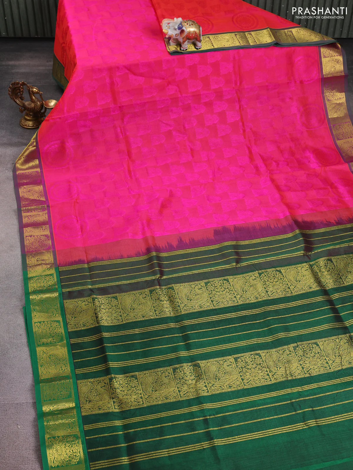 Silk cotton saree dual shade of pinkish orange and green with allover self emboss jacquard and zari woven border - Image 2