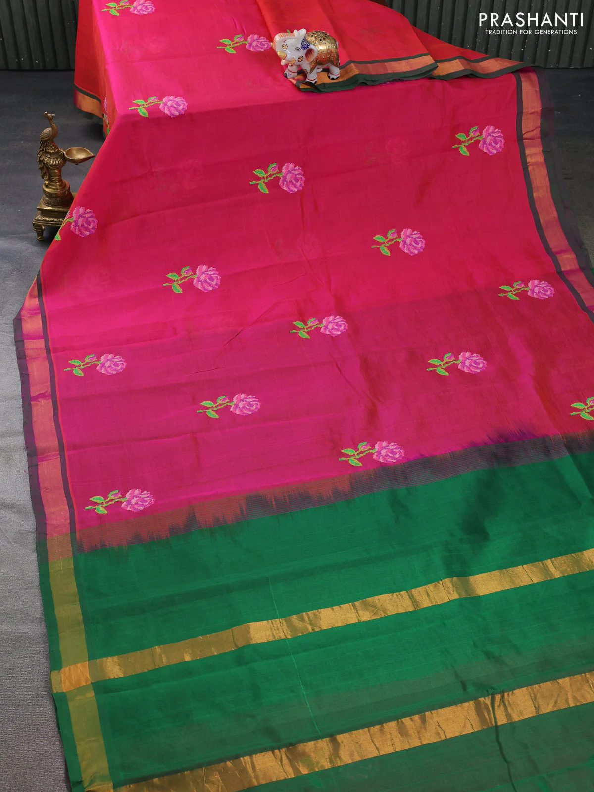 Silk cotton saree dual shade of pinkish orange with embroidery buttas and embroidery work border - Image 2