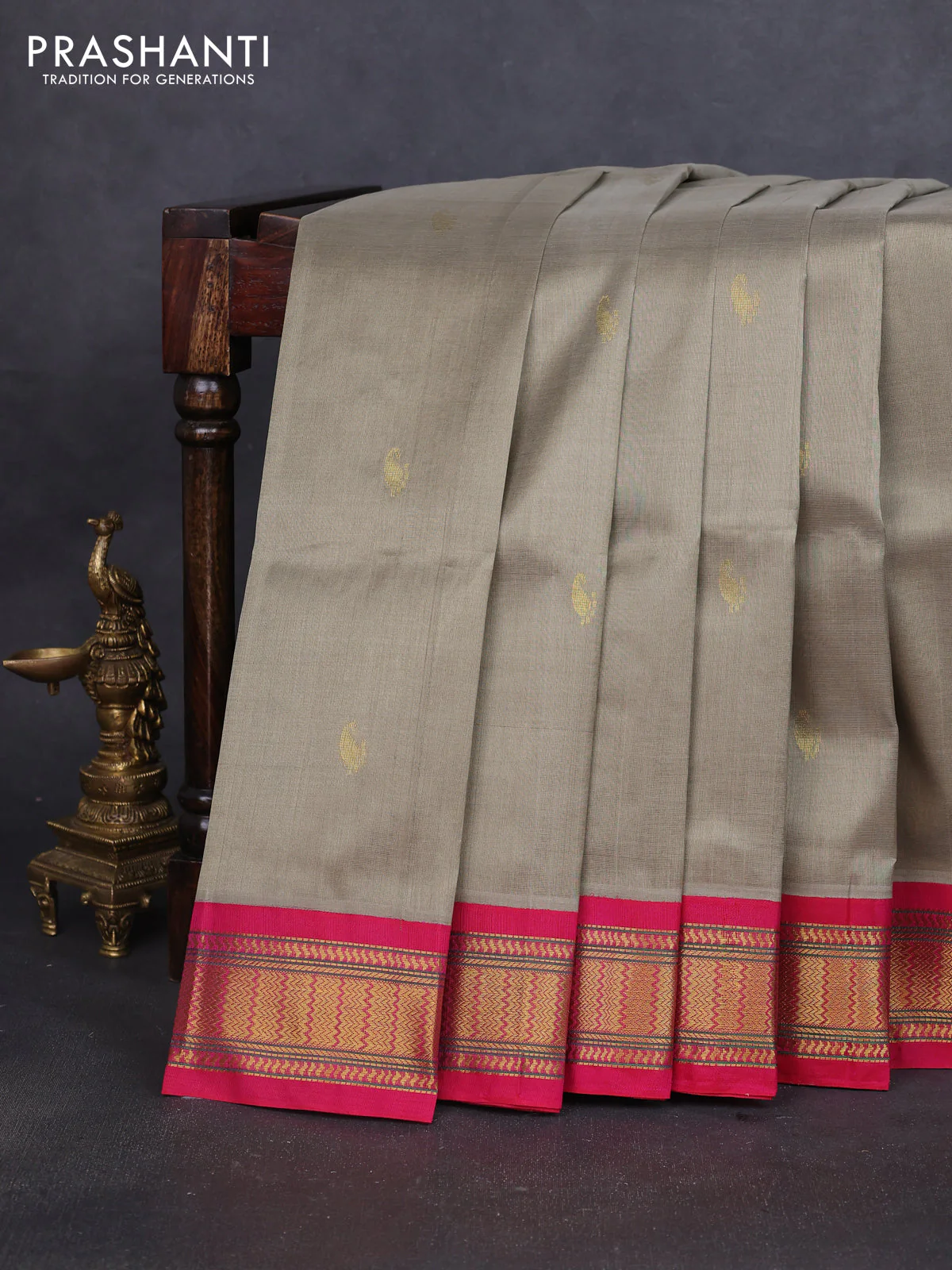 Silk cotton saree elaichi green shade and pink with paisley zari woven buttas and zari woven korvai border