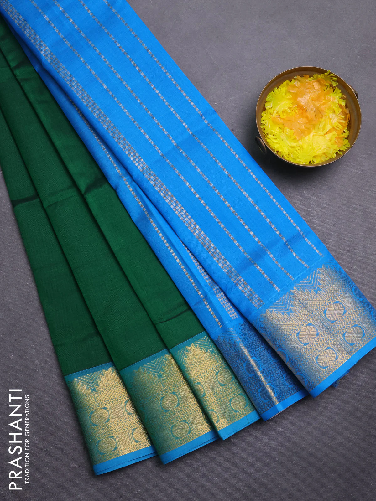 Silk cotton saree green and cs blue with plain body and zari woven border