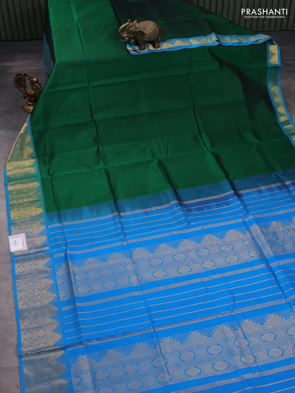 Silk cotton saree green and cs blue with plain body and zari woven border - Image 2