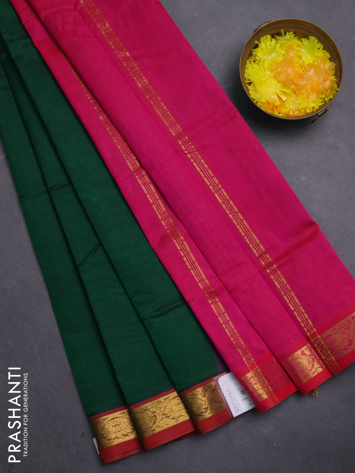 Silk cotton saree green and pink with plain body and zari woven border