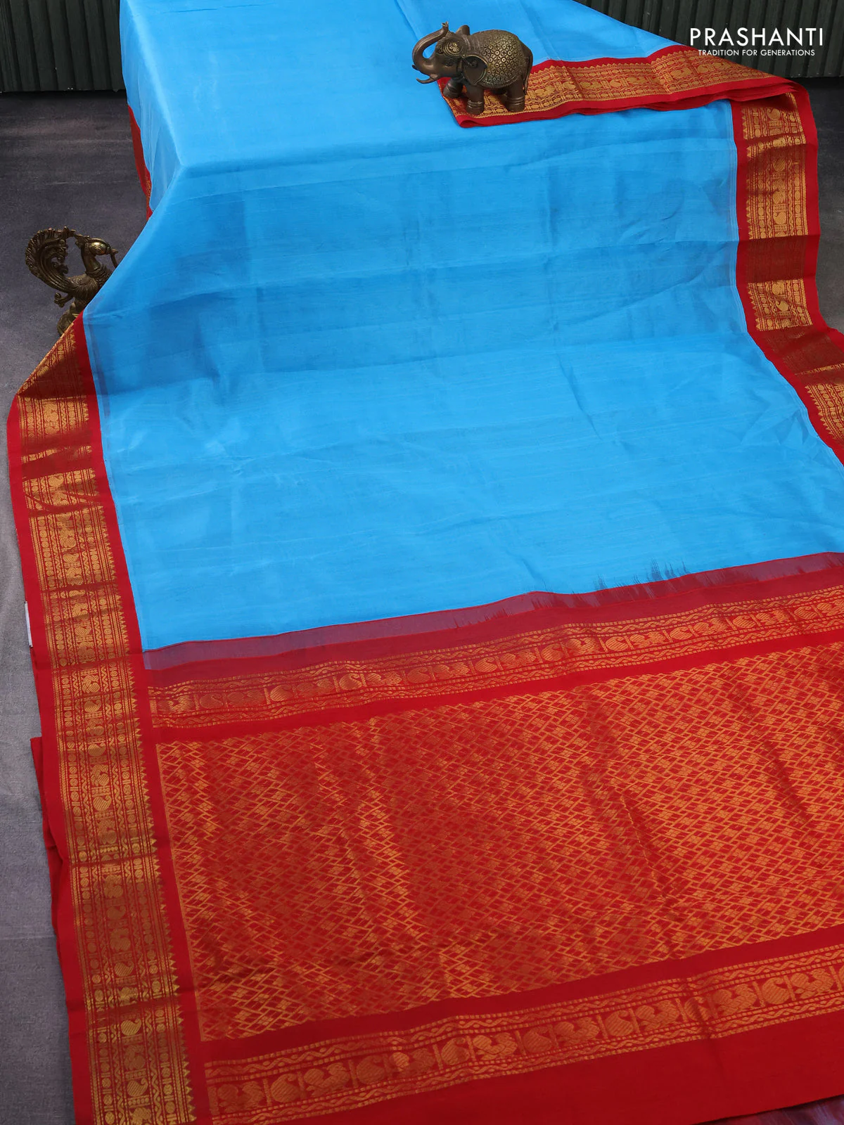 Silk cotton saree light blue and red with plain body and zari woven korvai border - Image 2
