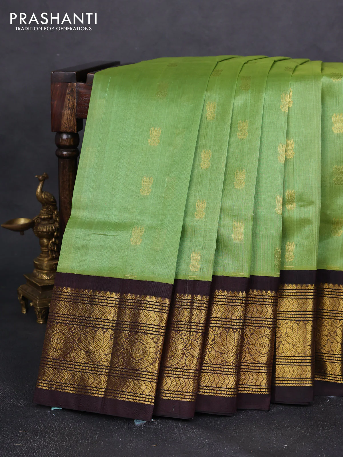 Silk cotton saree light green and coffee brown with zari woven buttas and zari woven korvai border