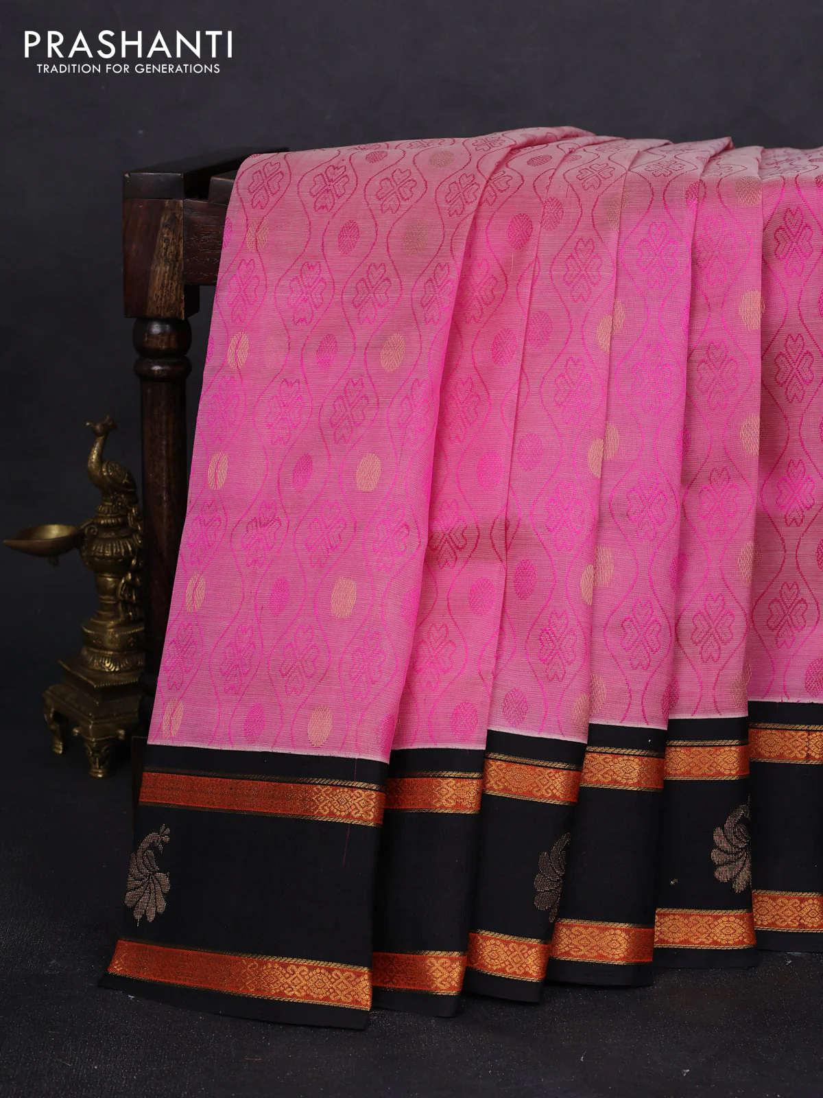 Silk cotton saree light pink and black with allover self emboss & zari buttas and rettapet zari woven korvai border