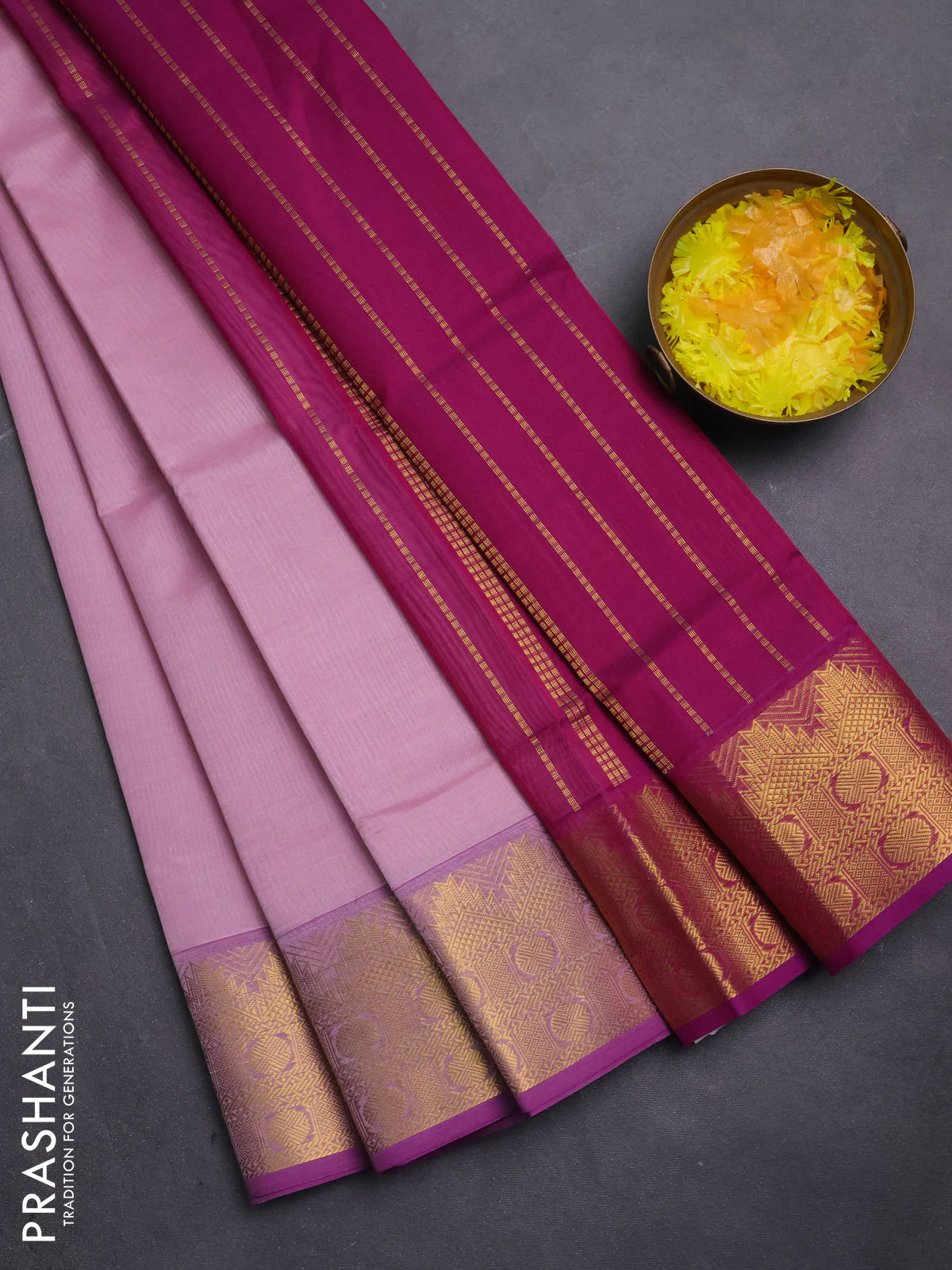 Silk cotton saree light pink and purple with plain body and zari woven border