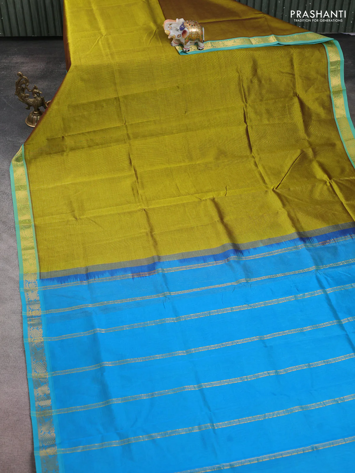 Silk cotton saree mehendi green and cs blue with plain body and zari woven border - Image 2
