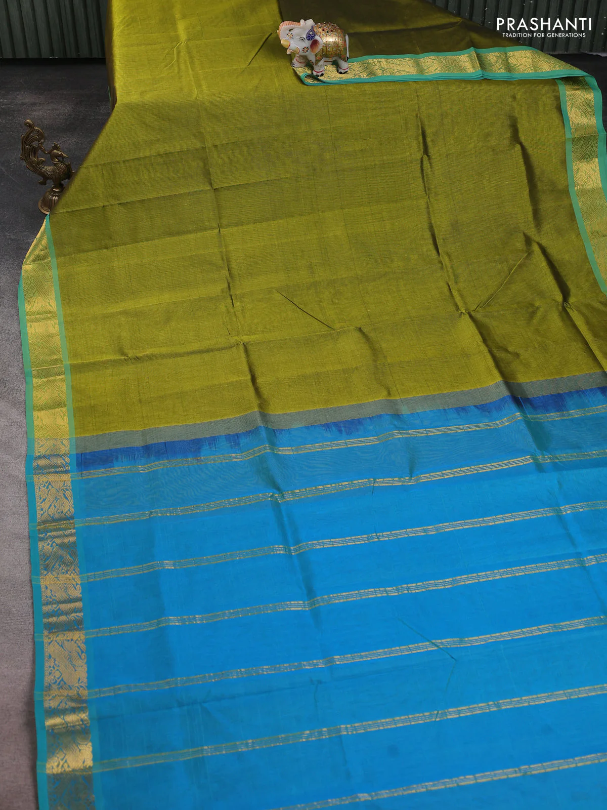 Silk cotton saree mehendi green and dual shade of teal blue with plain body and zari woven border - Image 2