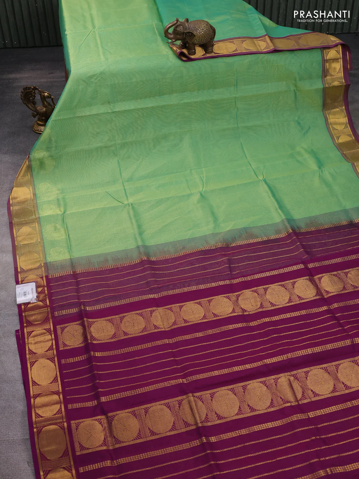 Silk cotton saree metallic green and purple with plain body and zari woven border - Image 2