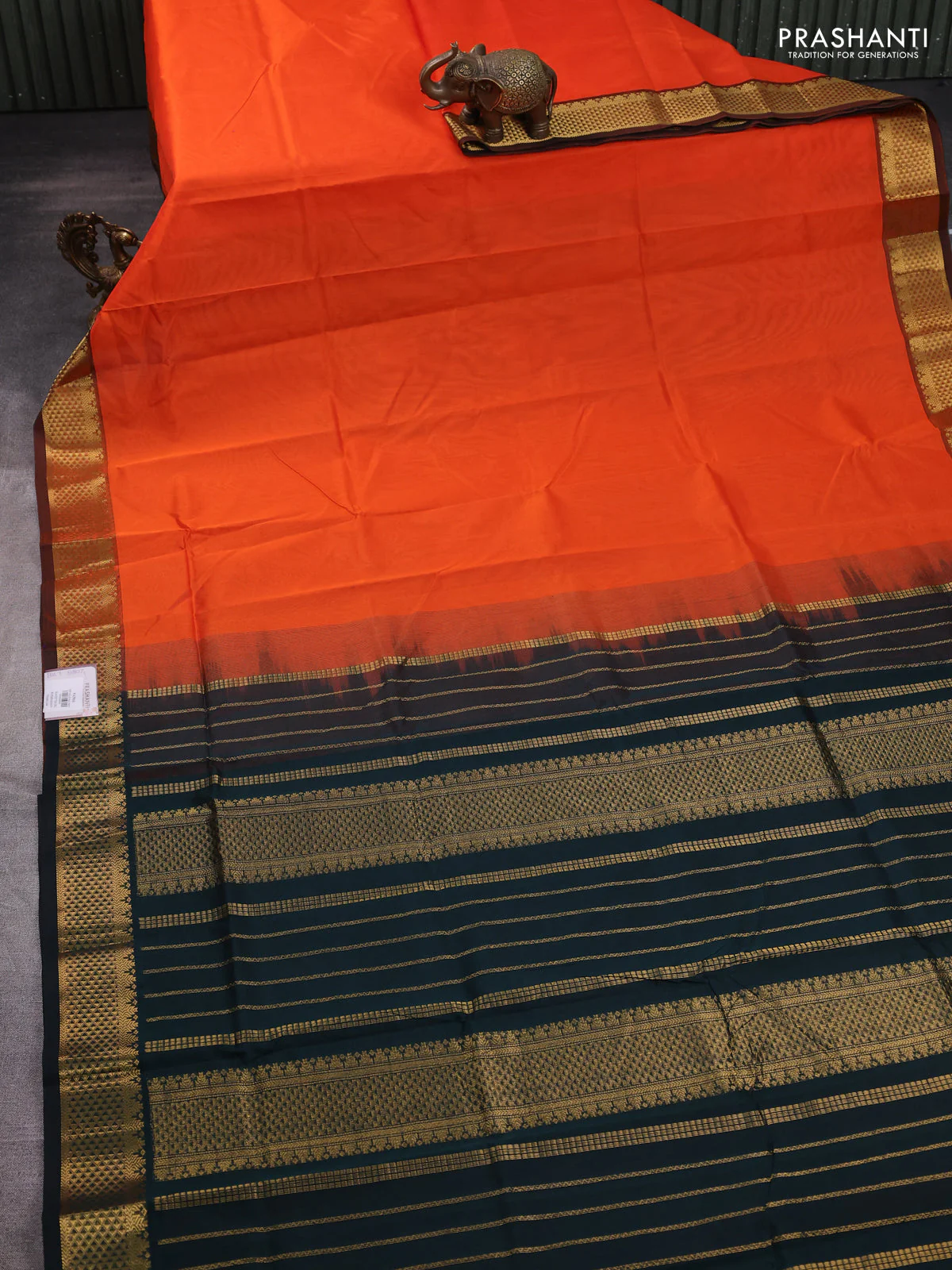Silk cotton saree orange and bottle green with plain body and zari woven border - Image 2