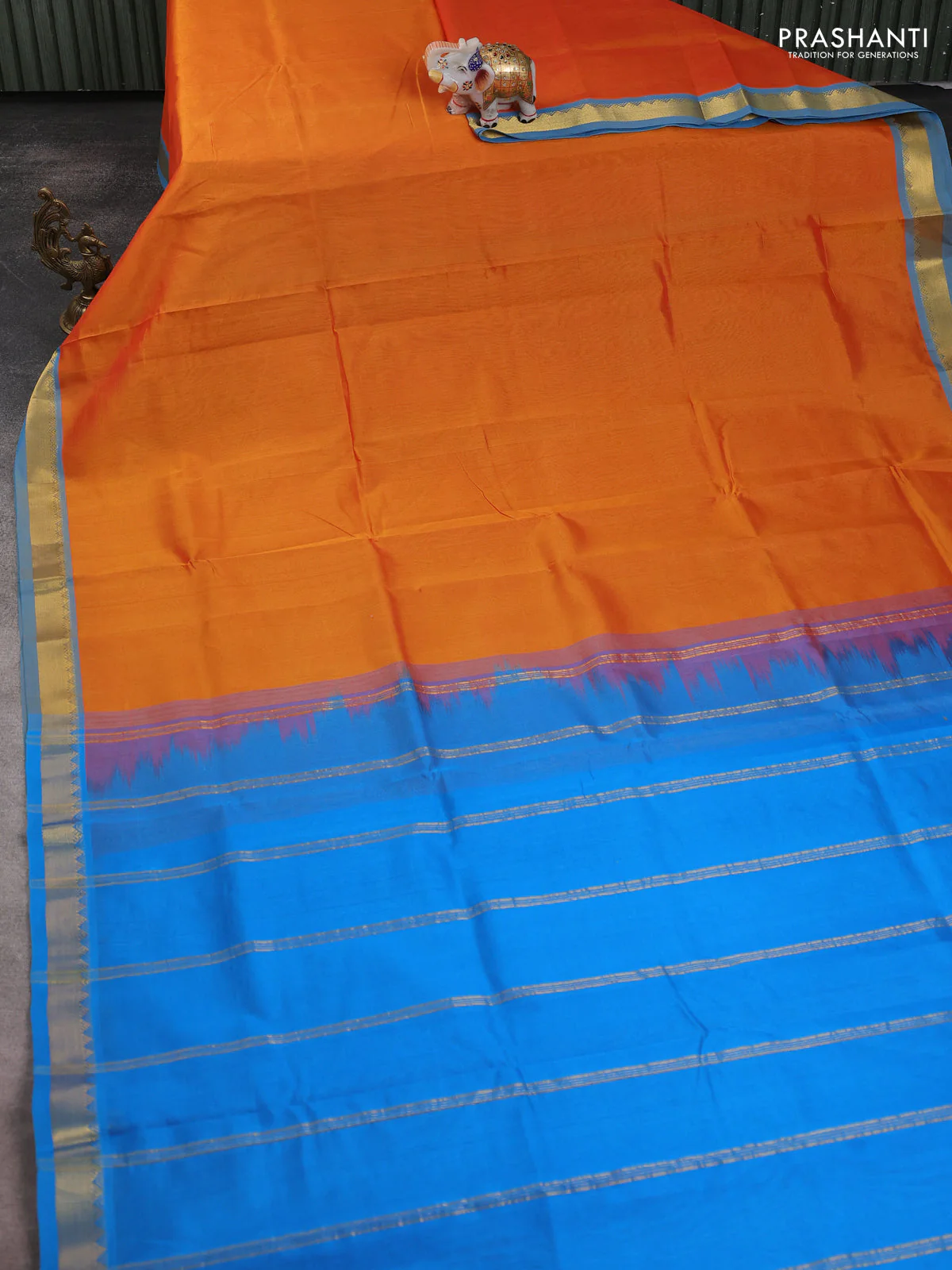Silk cotton saree orange and cs blue with plain body and zari woven border - Image 2