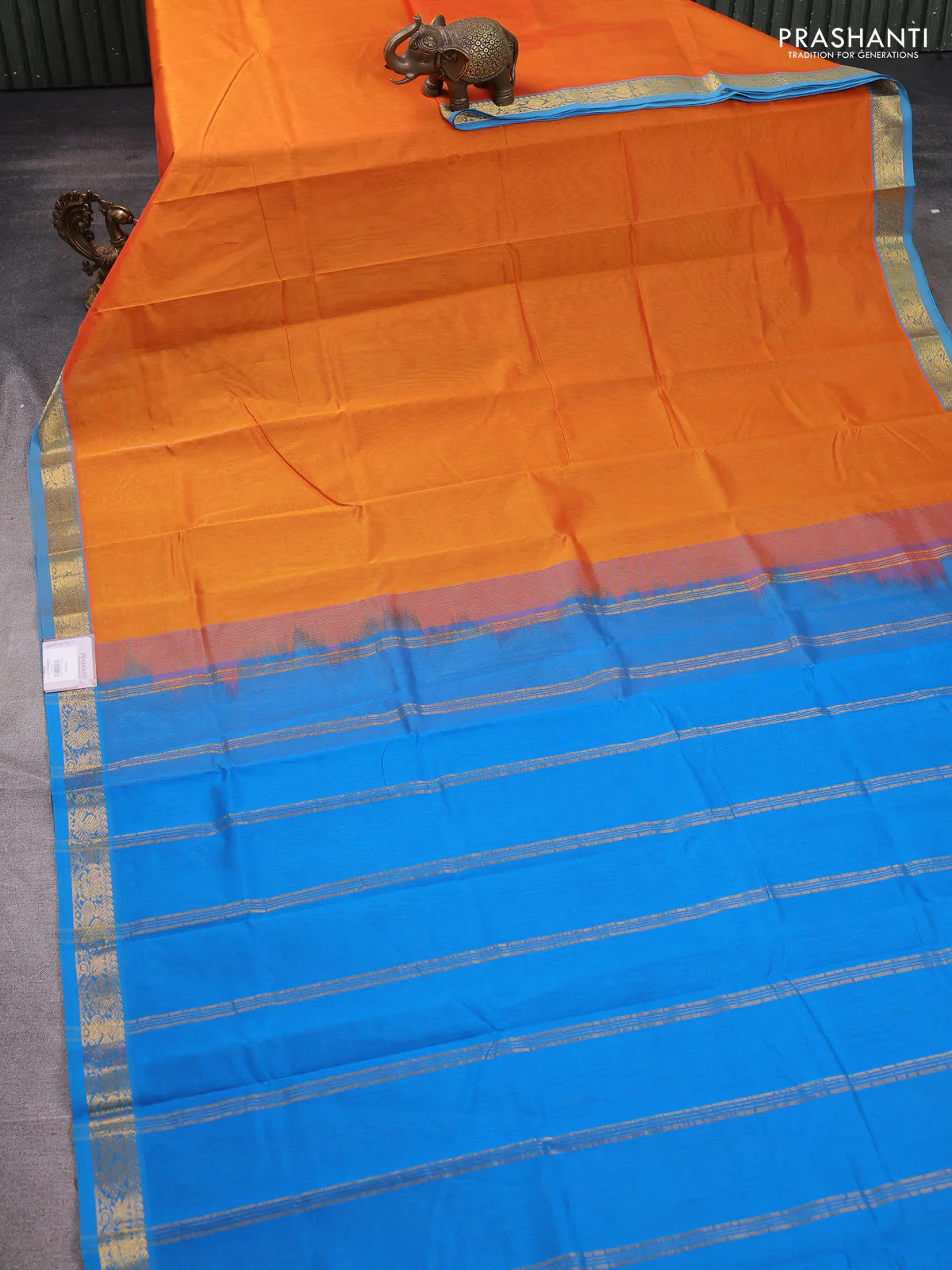 Silk cotton saree orange and cs blue with plain body and zari woven border - Image 2