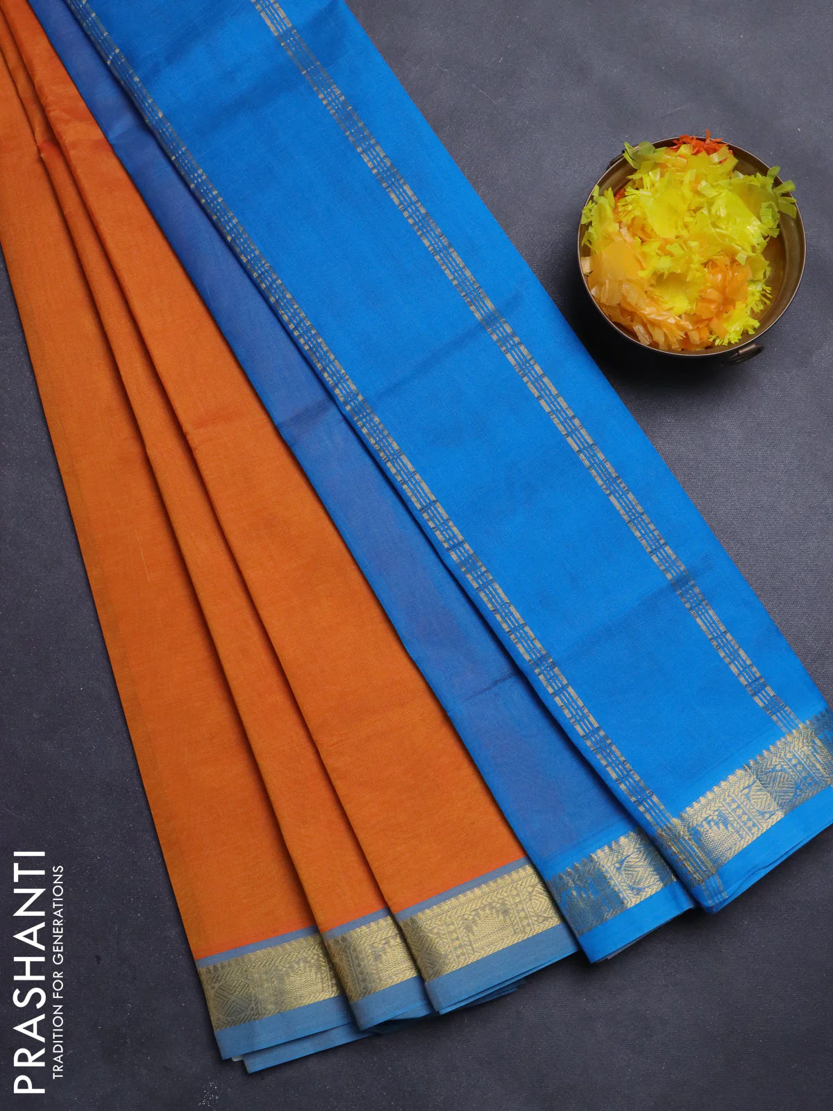 Silk Cotton saree orange and cs blue with plain body and zari woven border