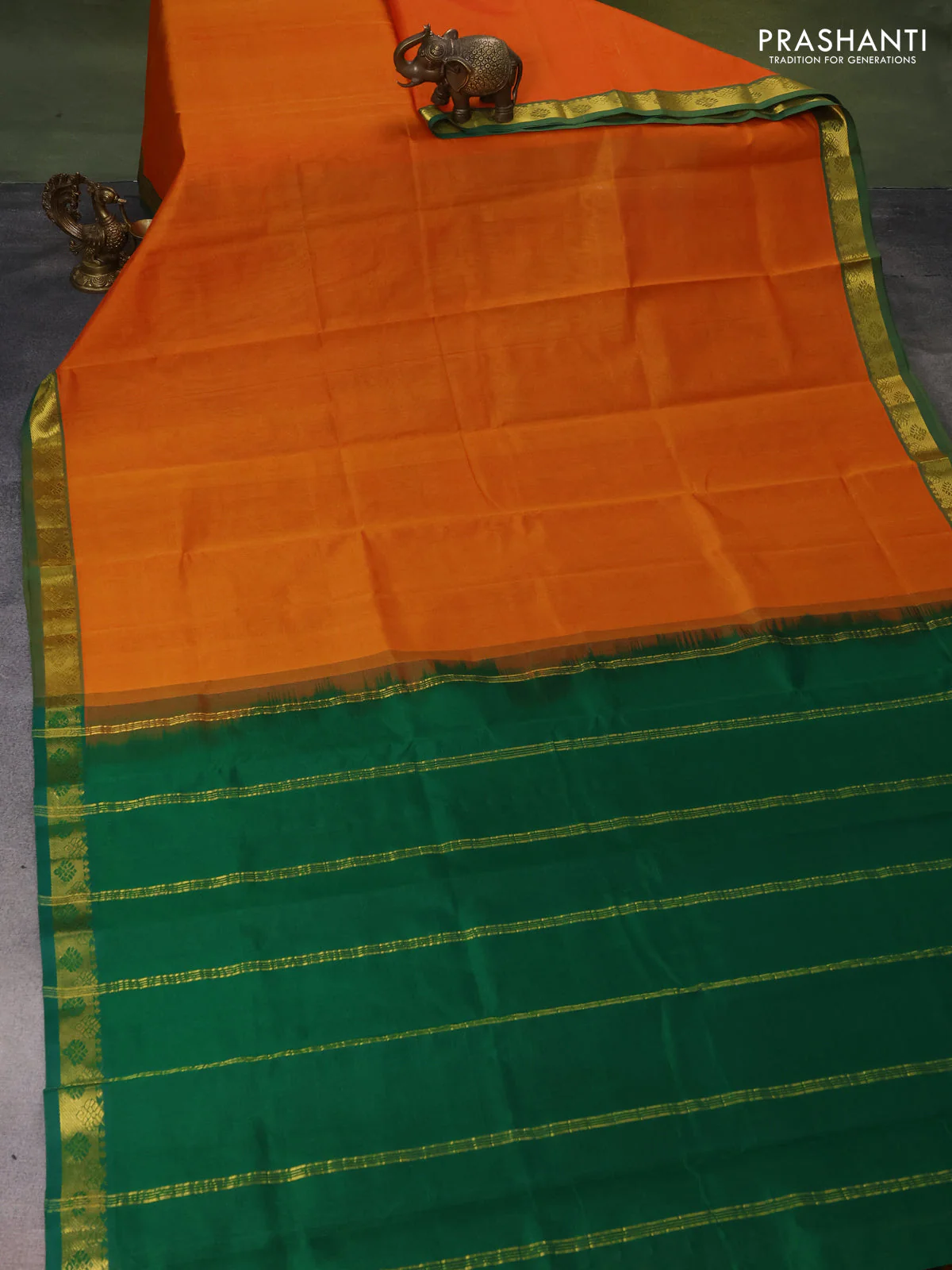 Silk cotton saree orange and green with plain body and zari woven border - Image 2