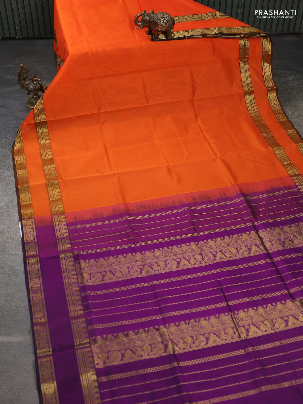 Silk cotton saree orange and purple with plain body and retttapet zari woven border - Image 2