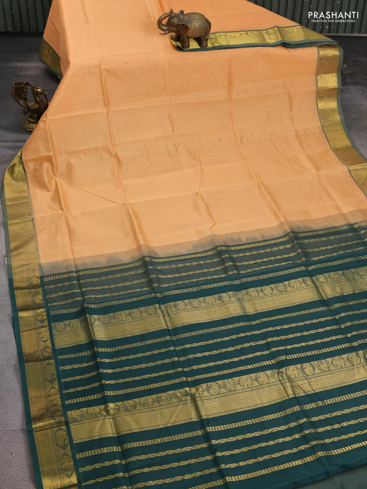 Silk cotton saree pale orange and bottle green with plain body and zari woven border - Image 2