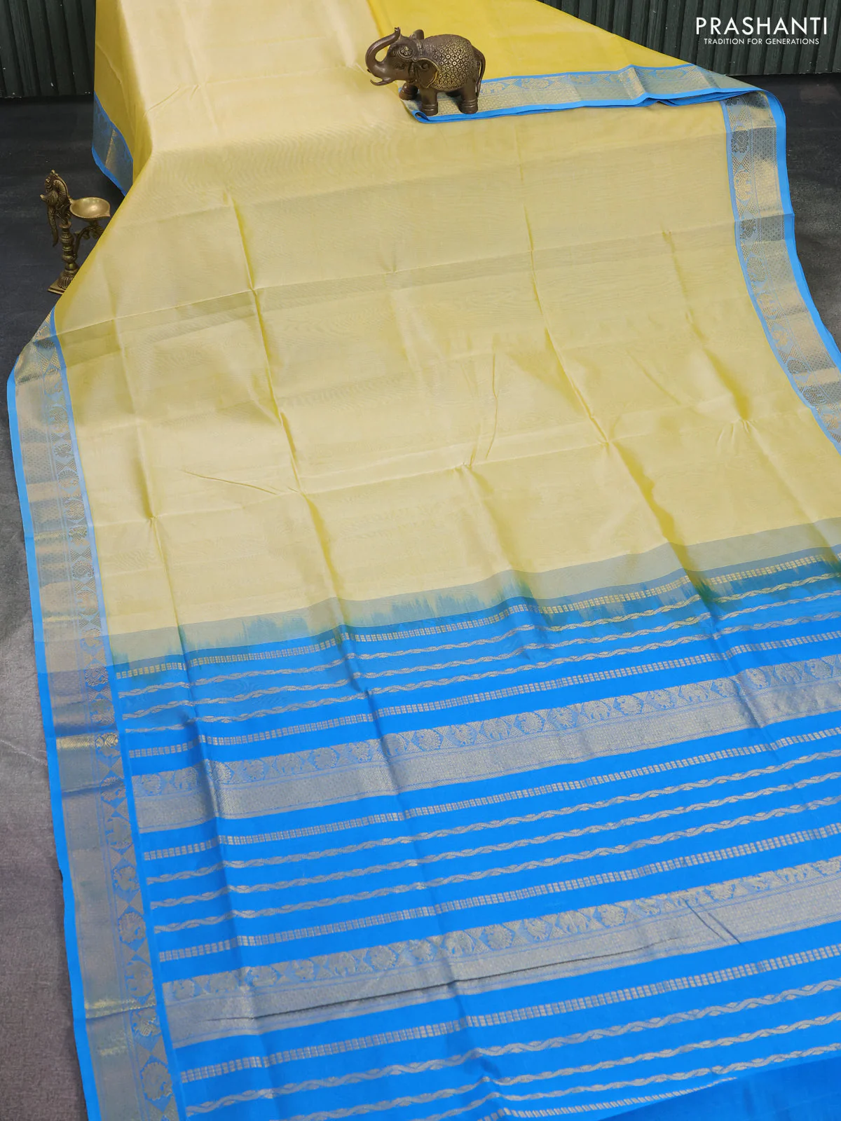 Silk cotton saree pale yellow and cs blue with plain body and zari woven border - Image 2