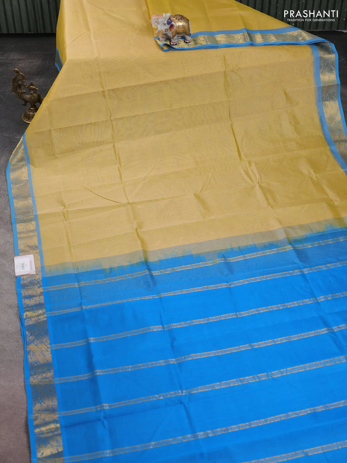 Silk cotton saree pale yellow and cs blue with plain body and zari woven border - Image 2