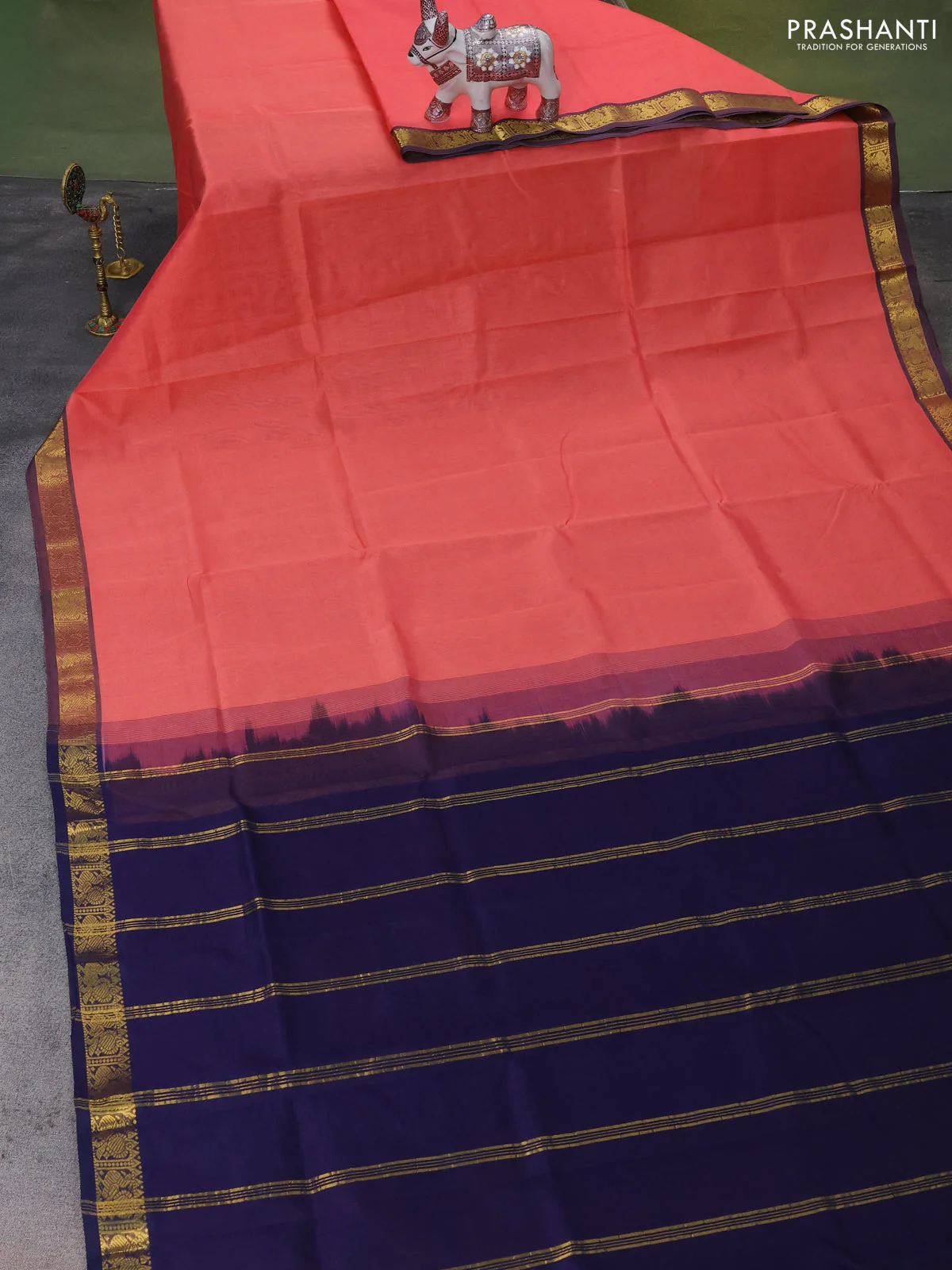 Silk Cotton saree peach orange and navy blue with plain body and zari woven border - Image 2