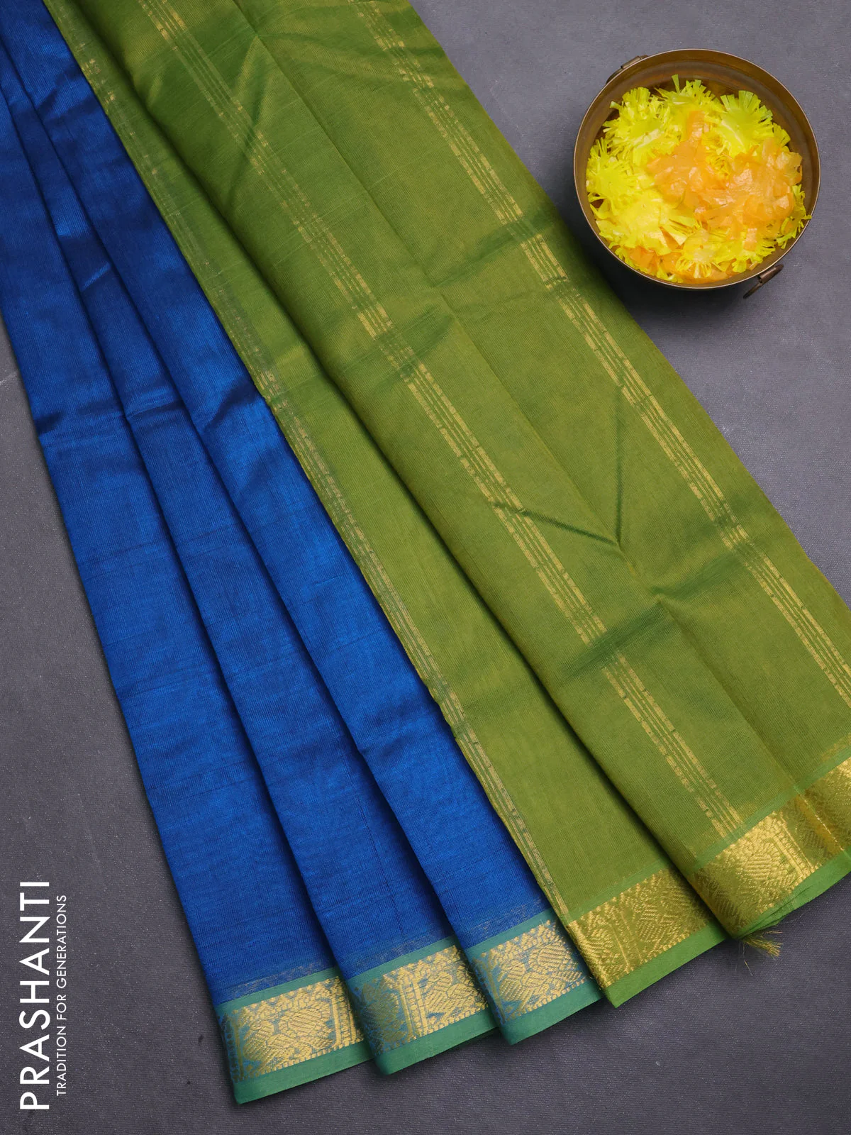 Silk cotton saree peacock blue and green shade with plain body and zari woven border