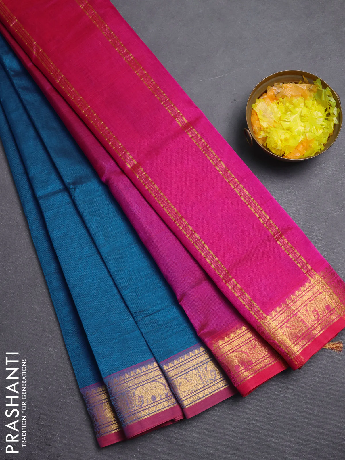 Silk cotton saree peacock blue and pink with plain body and zari woven border