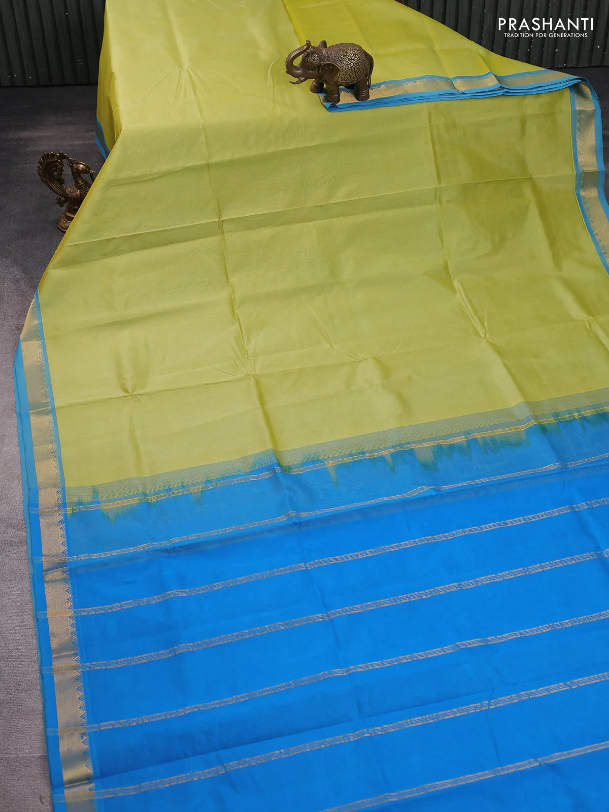 Silk cotton saree pista green and cs blue with plain body and zari woven border - Image 2
