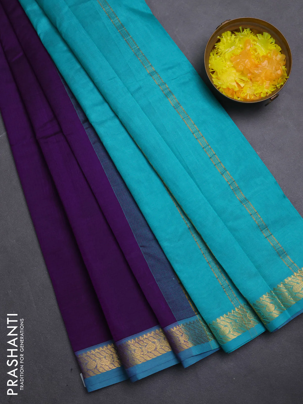 Silk cotton saree purple and teal blue with plain body and zari woven border